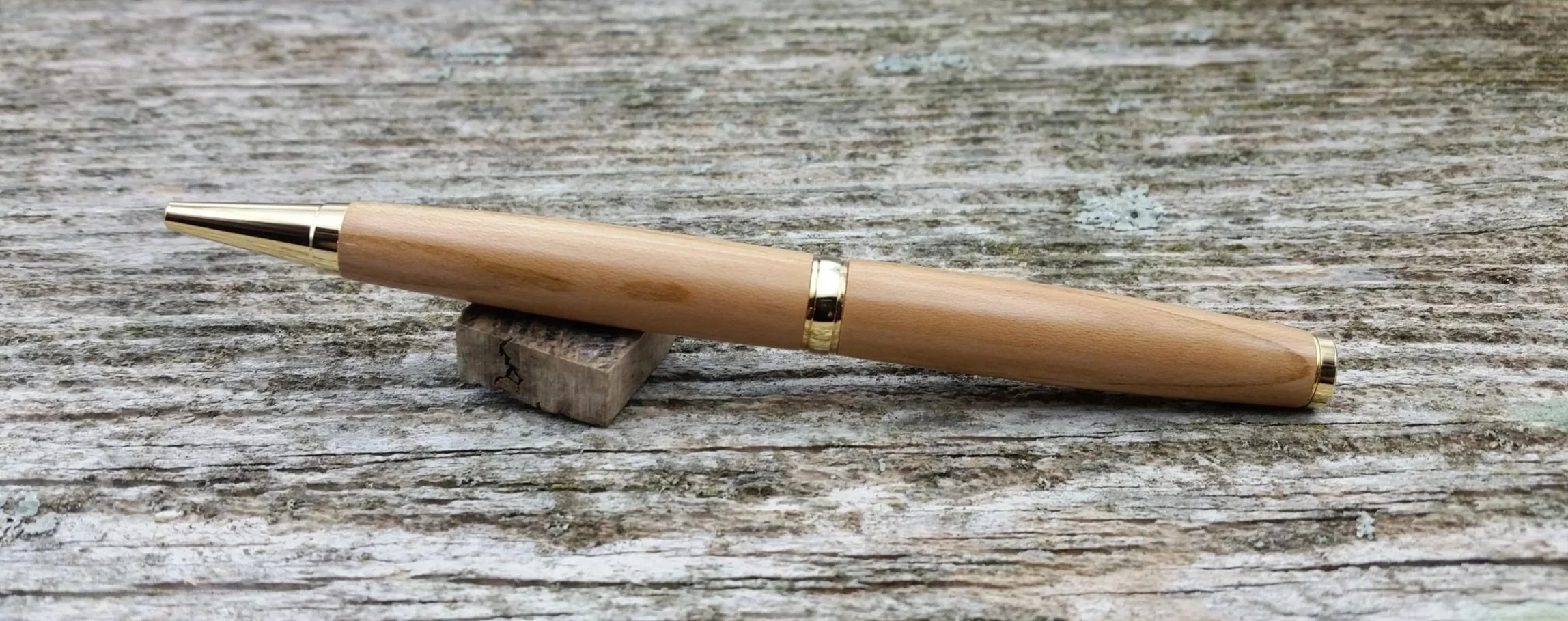 Parus Pen ballpoint twist pen with 10K gold hardware and apricot wood rear view