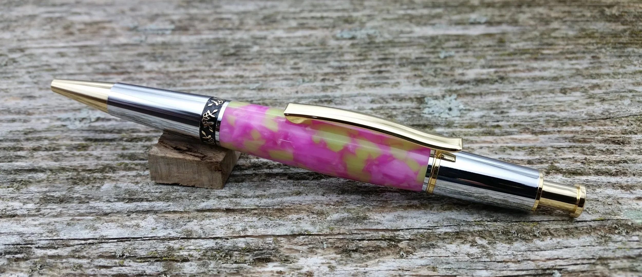 Parus Pen ballpoint click pen with 10K gold, chrome, and pink and green resin clip view
