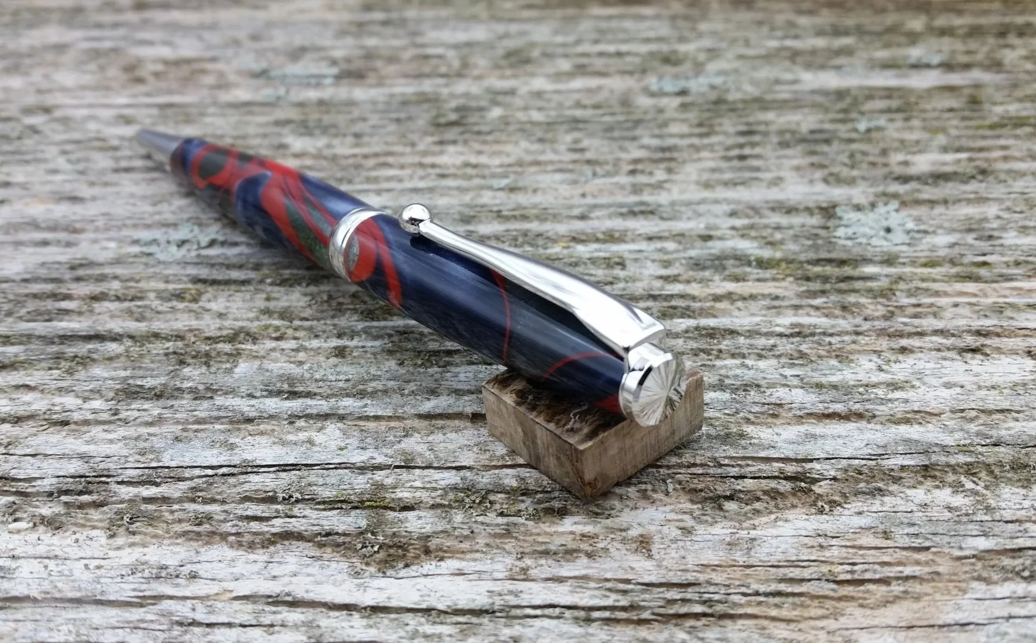 Parus Pen ballpoint twist pen with rhodium hardware and multicolored resin end view