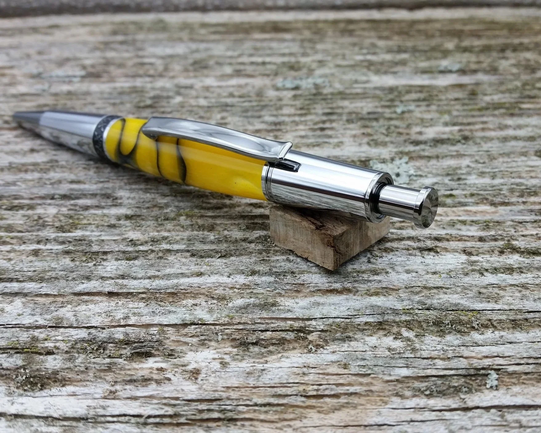 Parus Pen ballpoint click pen with black titanium, chrome, and pearlescent yellow resin end view.jpg