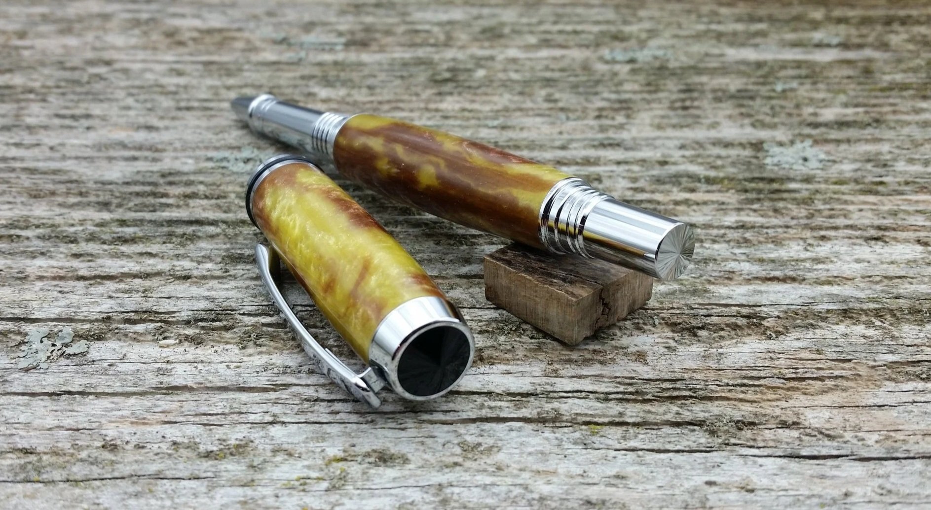 Parus Pen rollerball pen with yellow and brown resin and chrome hardware end view