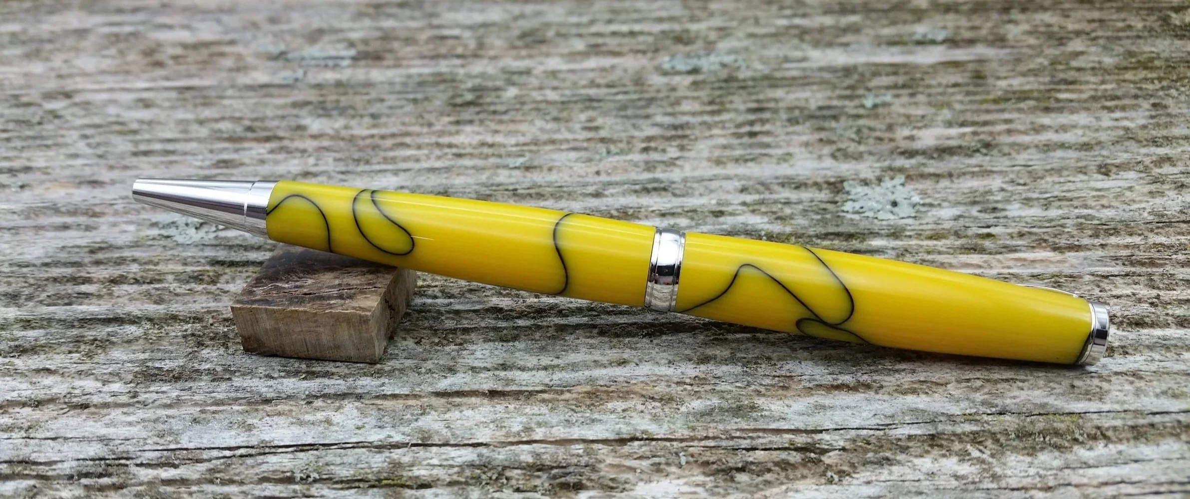 Parus Pen ballpoint twist pen with yellow resin and rhodium hardware rear view
