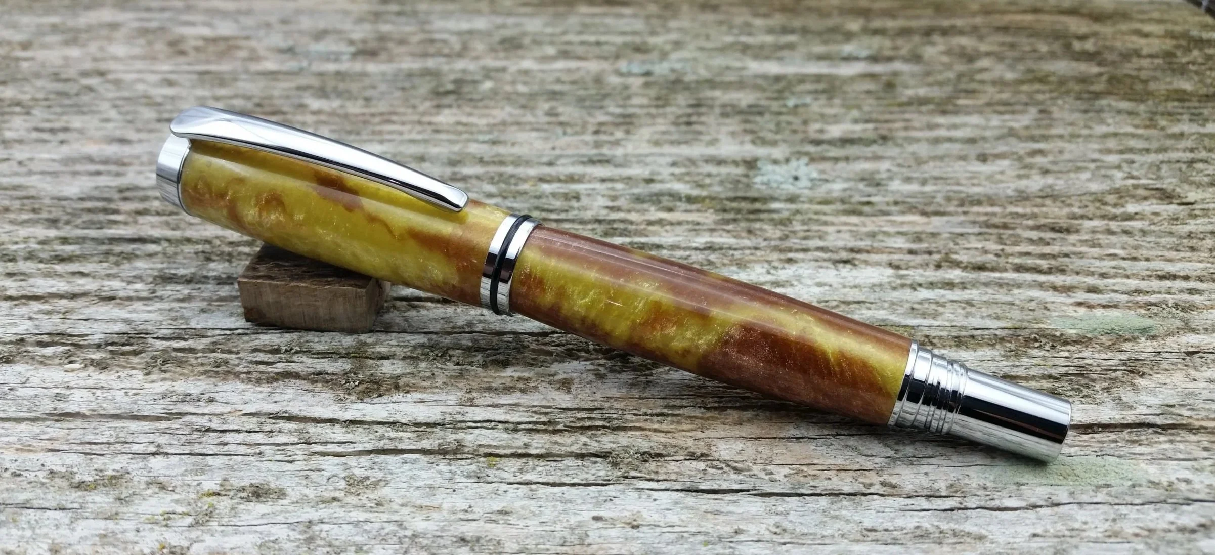Parus Pen rollerball pen with yellow and brown resin and chrome hardware clip view