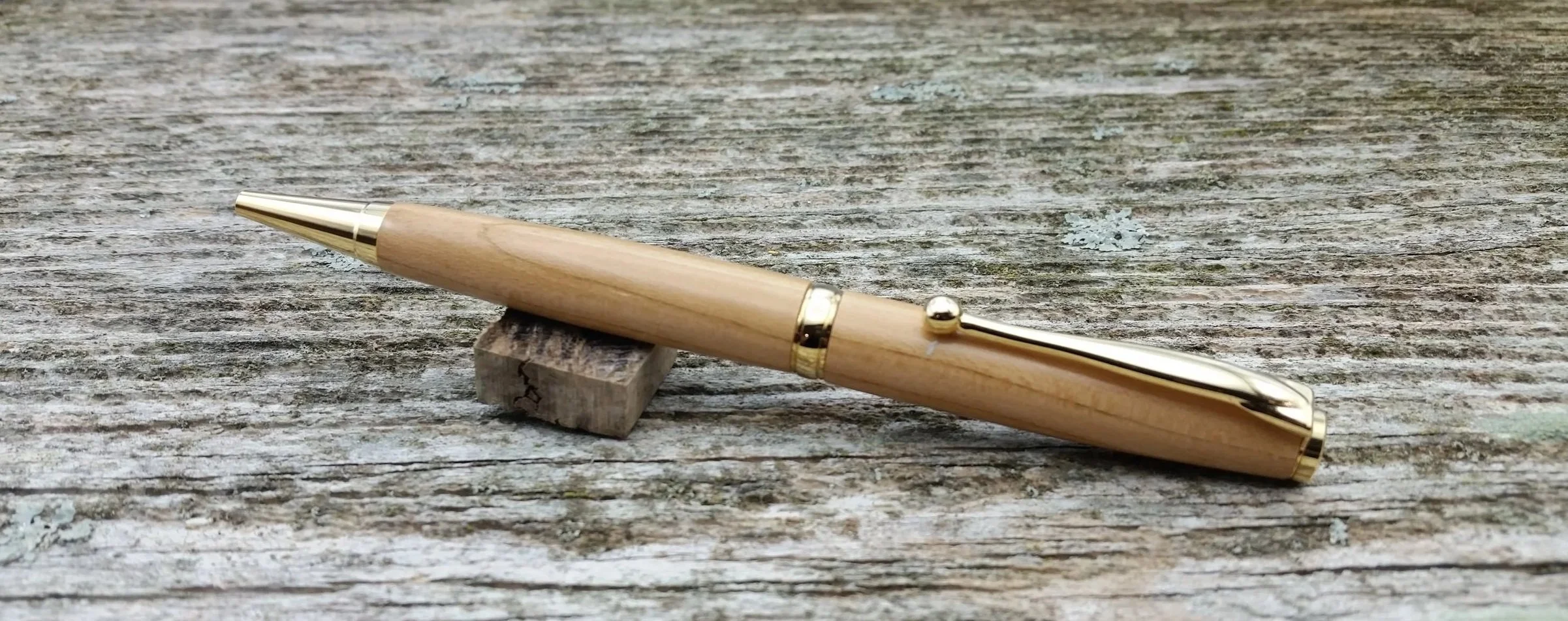 Parus Pen ballpoint twist pen with 10K gold hardware and apricot wood clip view