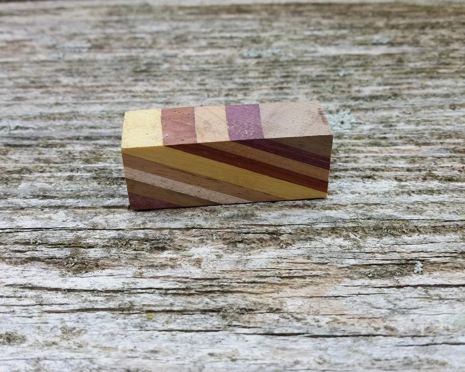 piece of a diagonal cut hardwood segmented pen blank