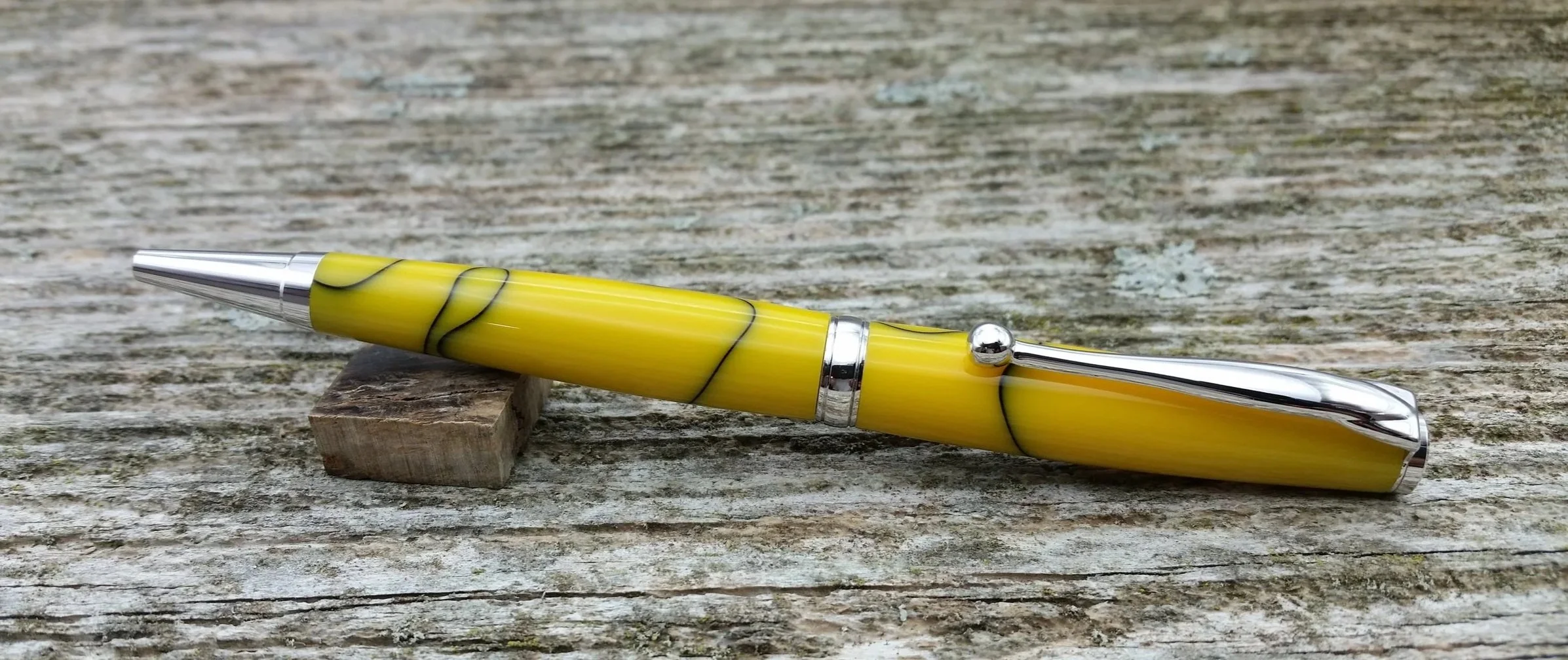 Parus Pen ballpoint twist pen with yellow resin and rhodium hardware clip view