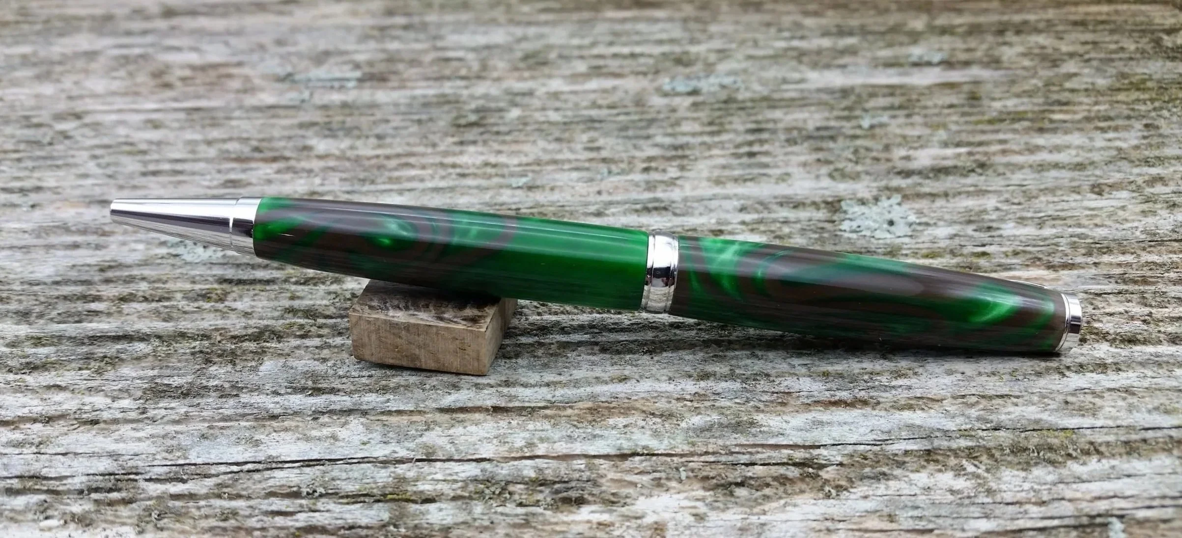 Parus Pen ballpoint twist pen with bright green and brown resin with rhodium hardware rear view