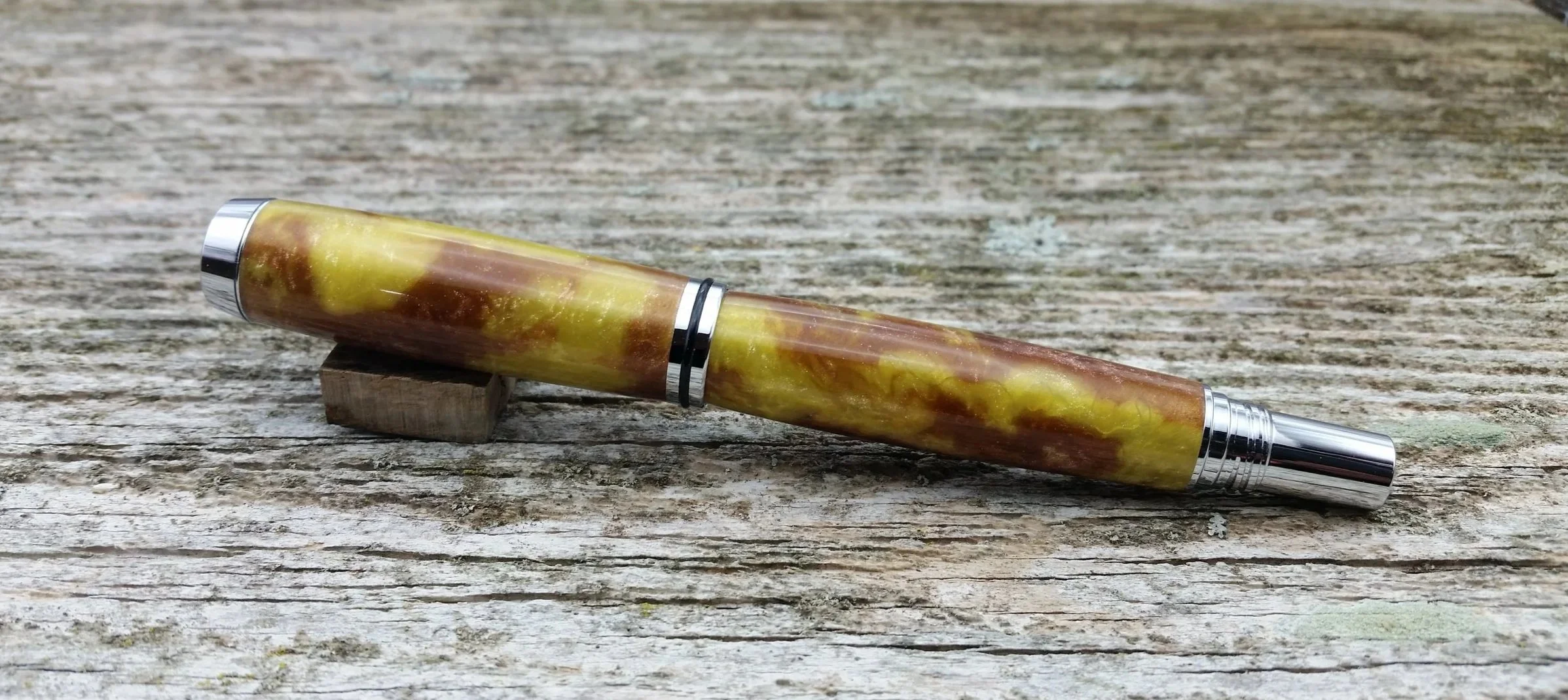Parus Pen rollerball pen with brown and yellow resin and chrome hardware rear view