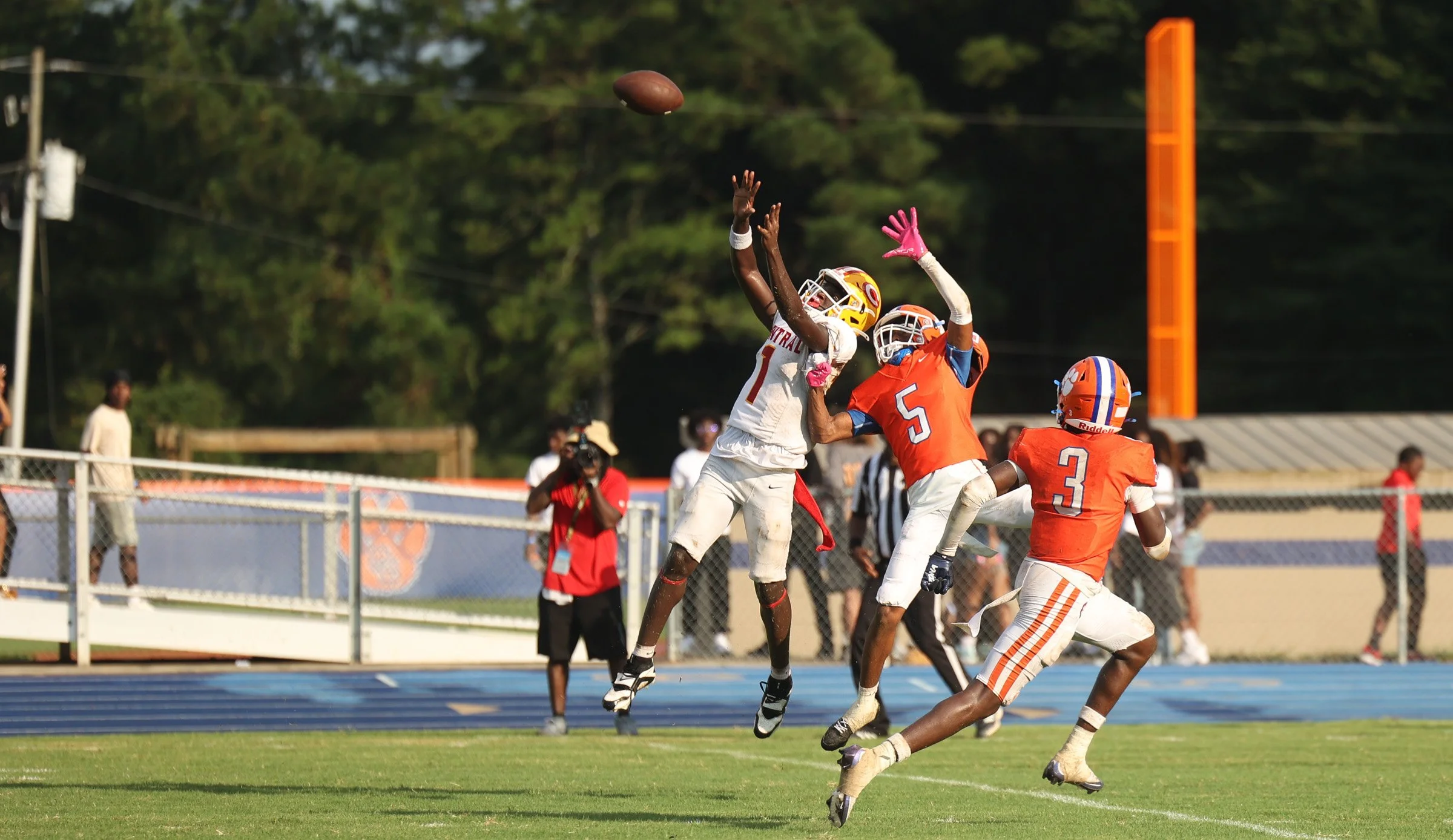 Clarke Central Wide Receiver Lagracion Little (1) attempts to catch a pass while being covered by Cedar Shoals Cornerback Santana Moreau (5) and Safety Deston Foote (3) during the Classic City Championship game at Water-Wilkins Stadium in Athens, Geo