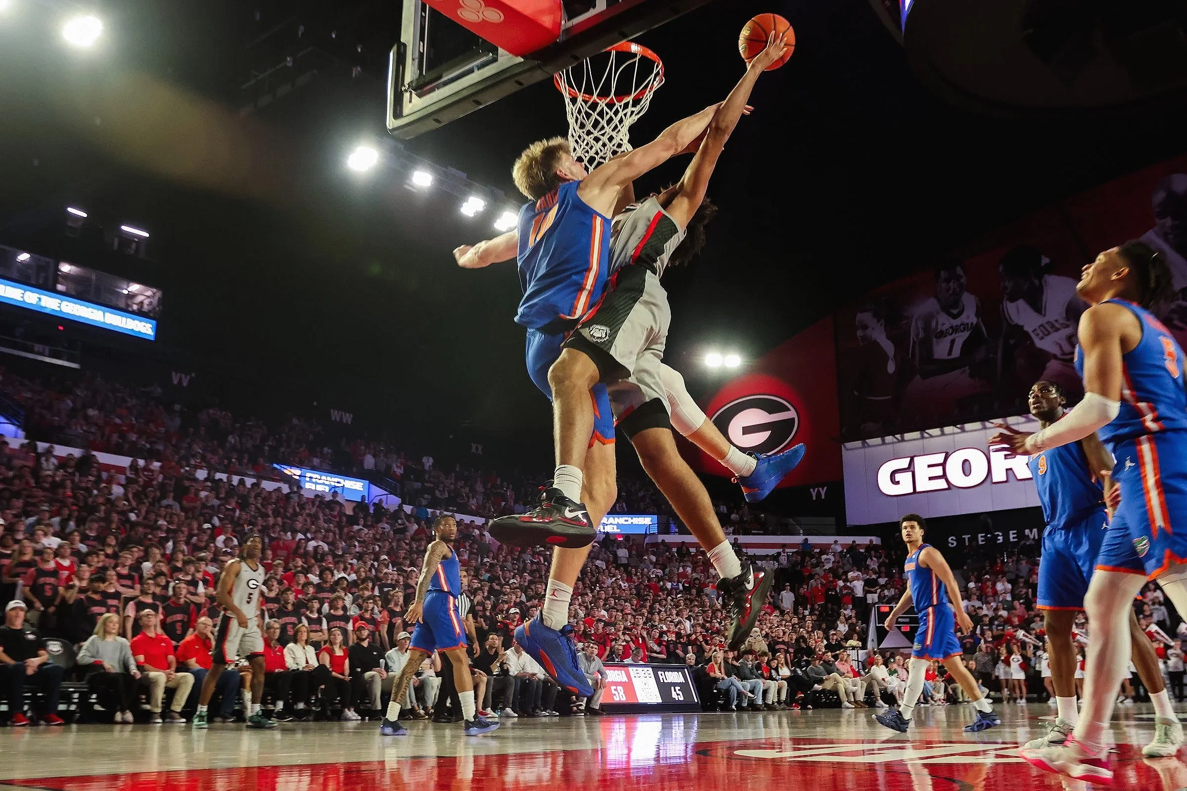 University of Georgia Forward Asa Newell attempts a dunk during the UGA vs. UF basketball game in Stegeman Coliseum in Athens, Georgia, on Tuesday, Feb. 25, 2025. The University of Georgia’s Men’s basketball team defeated the University of Florida te