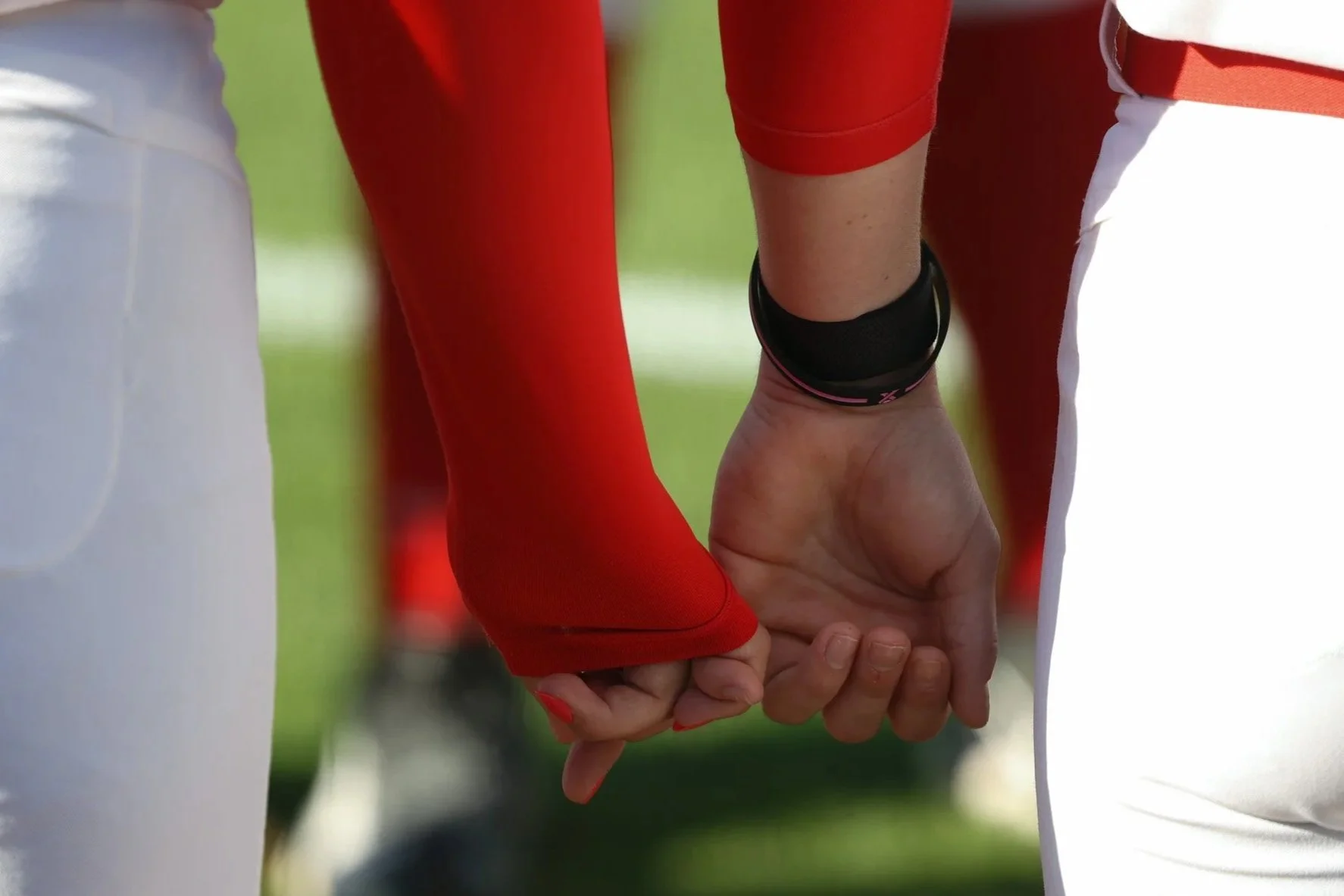 Teammates hold hands before prayer during the Georgia vs. USC Upstate softball game at Jack Turner Stadium in Athens, Georgia, on Wednesday, April 9, 2025. The 16th-ranked Georgia Bulldogs defeated the USC Upstate Spartans 3-2 on Wednesday in the nin