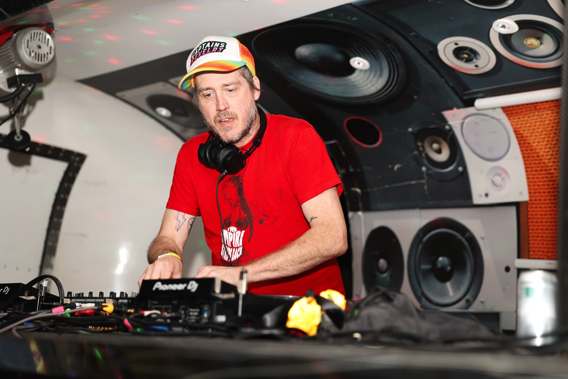A DJ plays music for attendees during the 17th Wild Rumpus Halloween Parade & Spectacle in downtown Athens, Georgia, or Saturday, Oct. 25, 2025. The night began with a parade that marched through downtown, followed by a night of music and entertainme