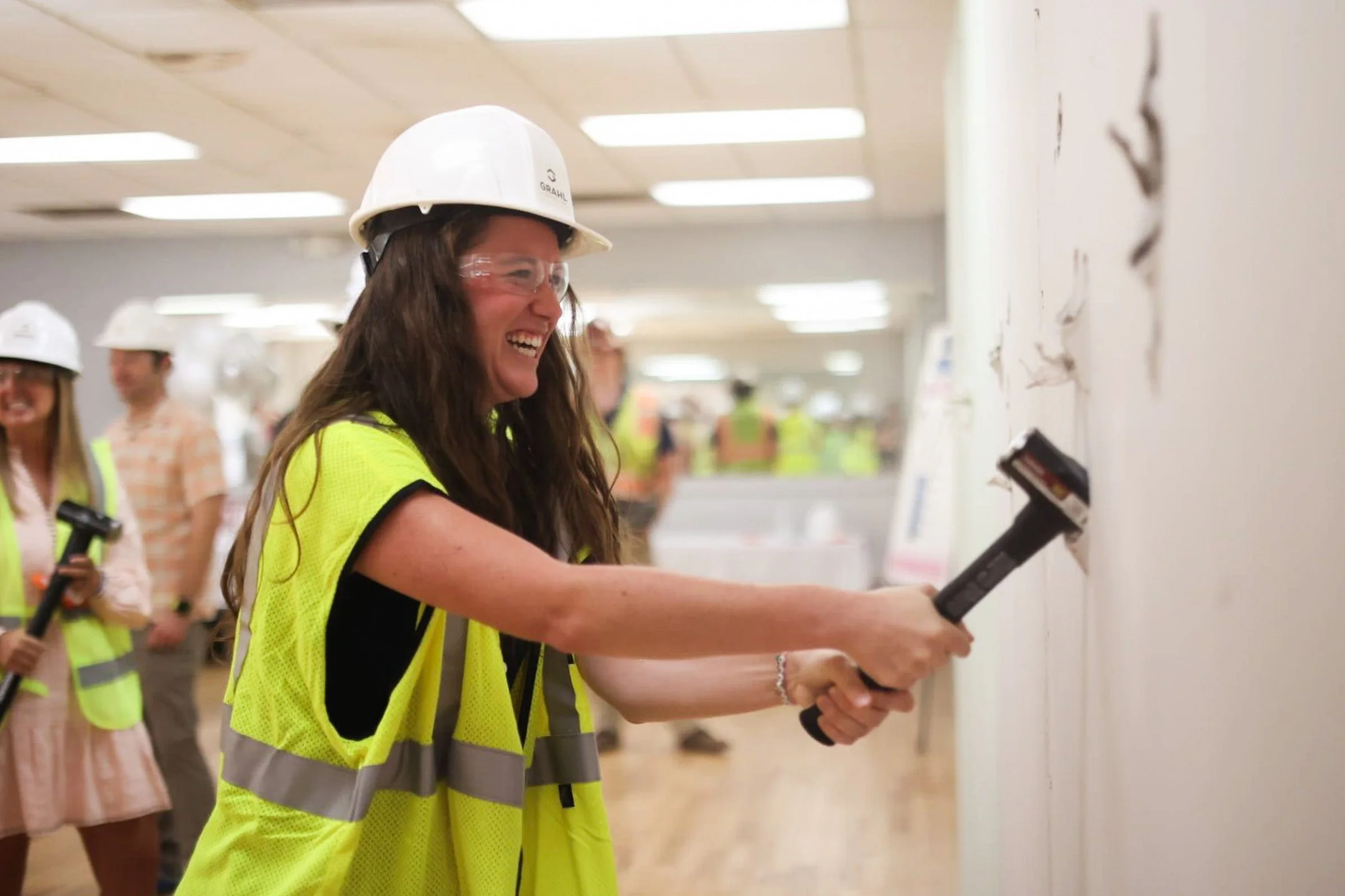 A member of the YMCA staff breaks through drywall at the Hawthorne Avenue location during the YMCA groundbreaking ceremony in Athens, Georgia, on Tuesday, Sept. 2025. The Hawthorne Avenue YMCA location will launch a $9.3 million improvement project, 
