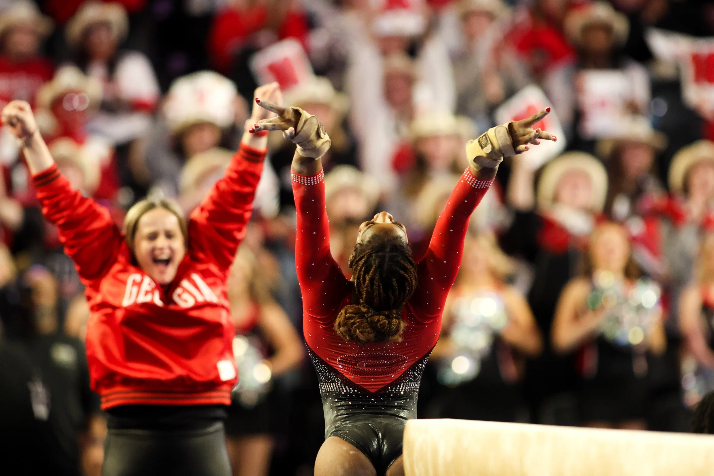 Georgia Junior Ja’ Free Scott celebrates with her Co-Head Coach Cécile Canqueteau-Landi after her beam routine during the UGA vs. Alabama gymnastics meet in Stegeman Coliseum in Athens, Georgia, on Thursday, Jan. 30, 2025. The No. 12 Georgia GymDogs 