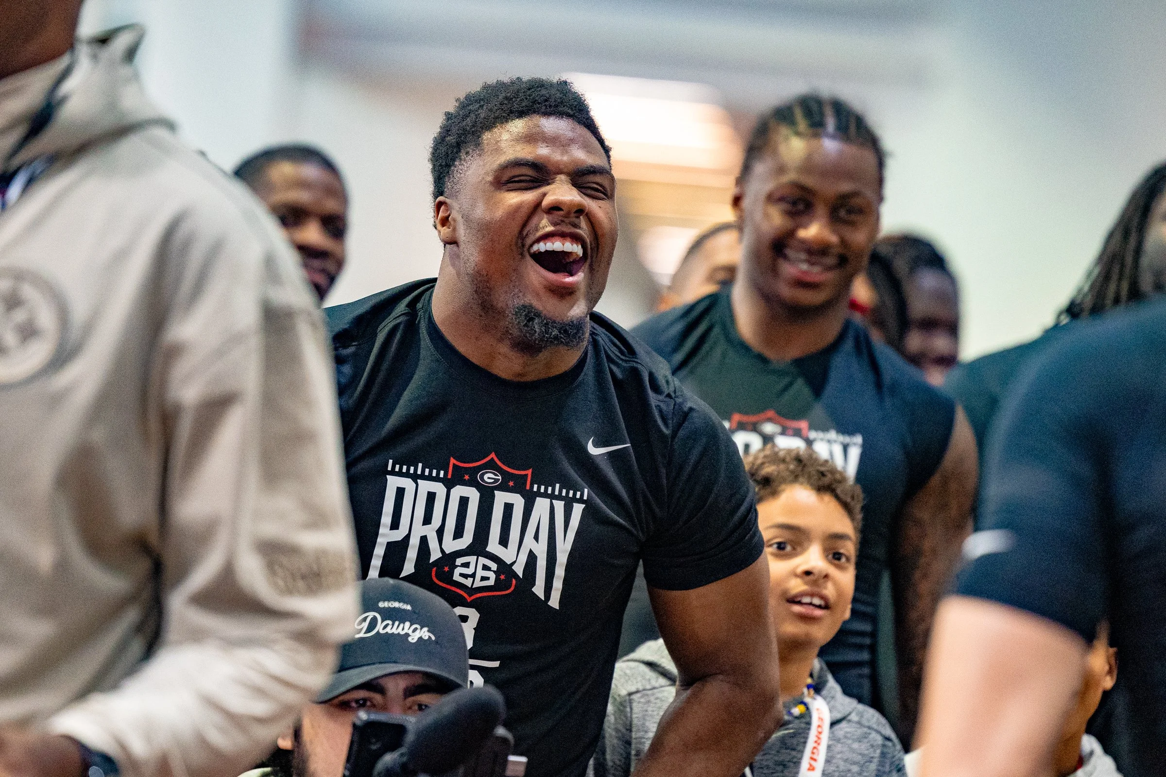 Georgia inside linebacker C.J. Allen (3) celebrates with his teammate Cash Jones (32) after his bench press performance during the 2026 UGA Pro-day at the UGA Indoor Practice Facility in Athens, Georgia, on Wednesday, March 18, 2026. Georgia football