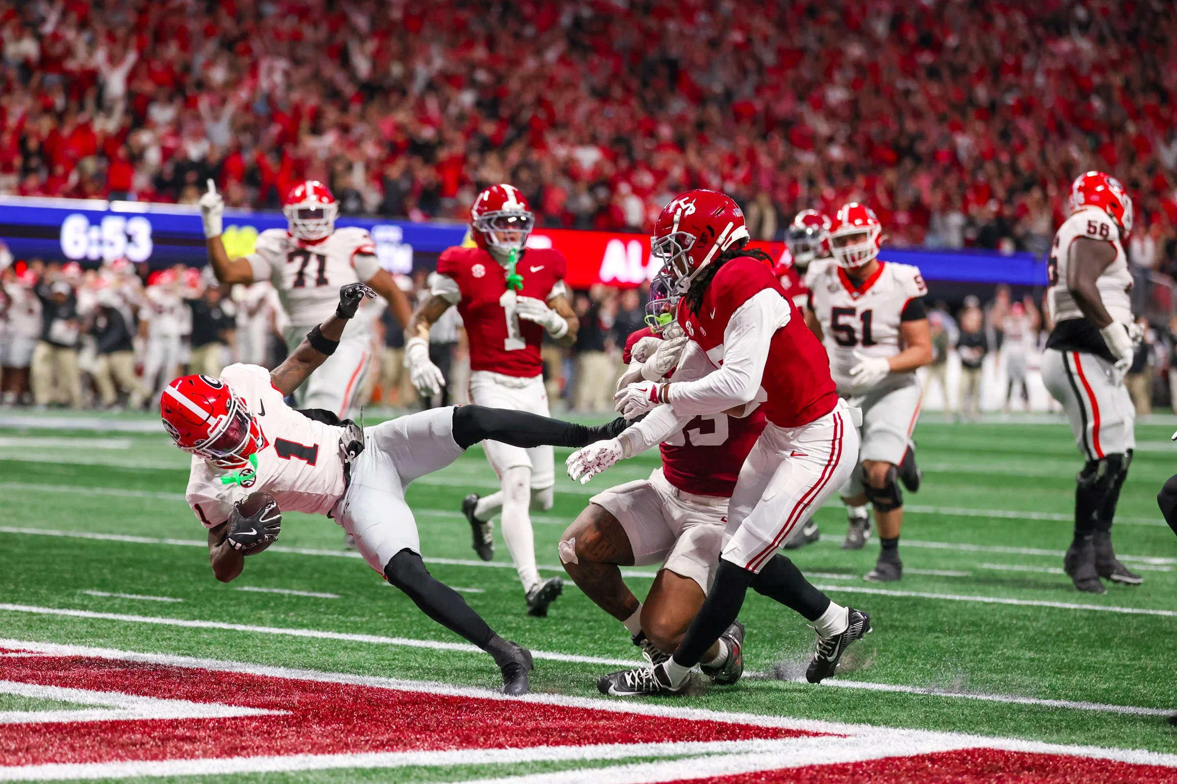 Georgia wide receiver Zachariah Branch (1) scores a touchdown during  the second half of the SEC Championship game between Georgia and Alabama at Mercedes-Benz Stadium in Atlanta, Georgia, on Saturday, Dec. 6, 2025. Georgia won 28-7. (Photo/Kaleb Tat
