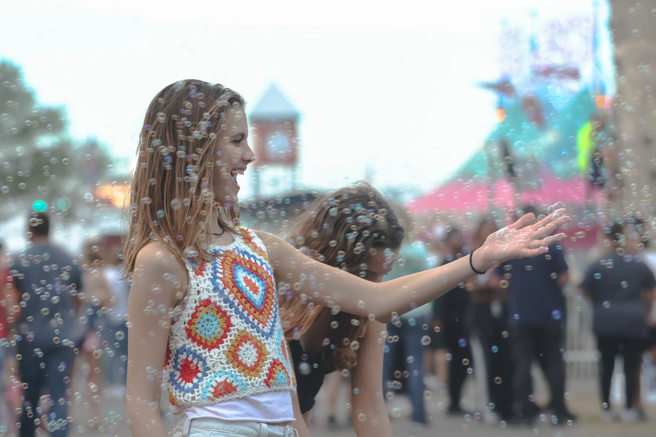 Elle DeShaw, 12,  plays with bubbles at the Georgia National Fairgrounds & Agriculture Center in Perry, Georgia, on Oct. 5, 2024. Elle attends the fair traditionally with her friends and family. (Photo/Kaleb Tatum)