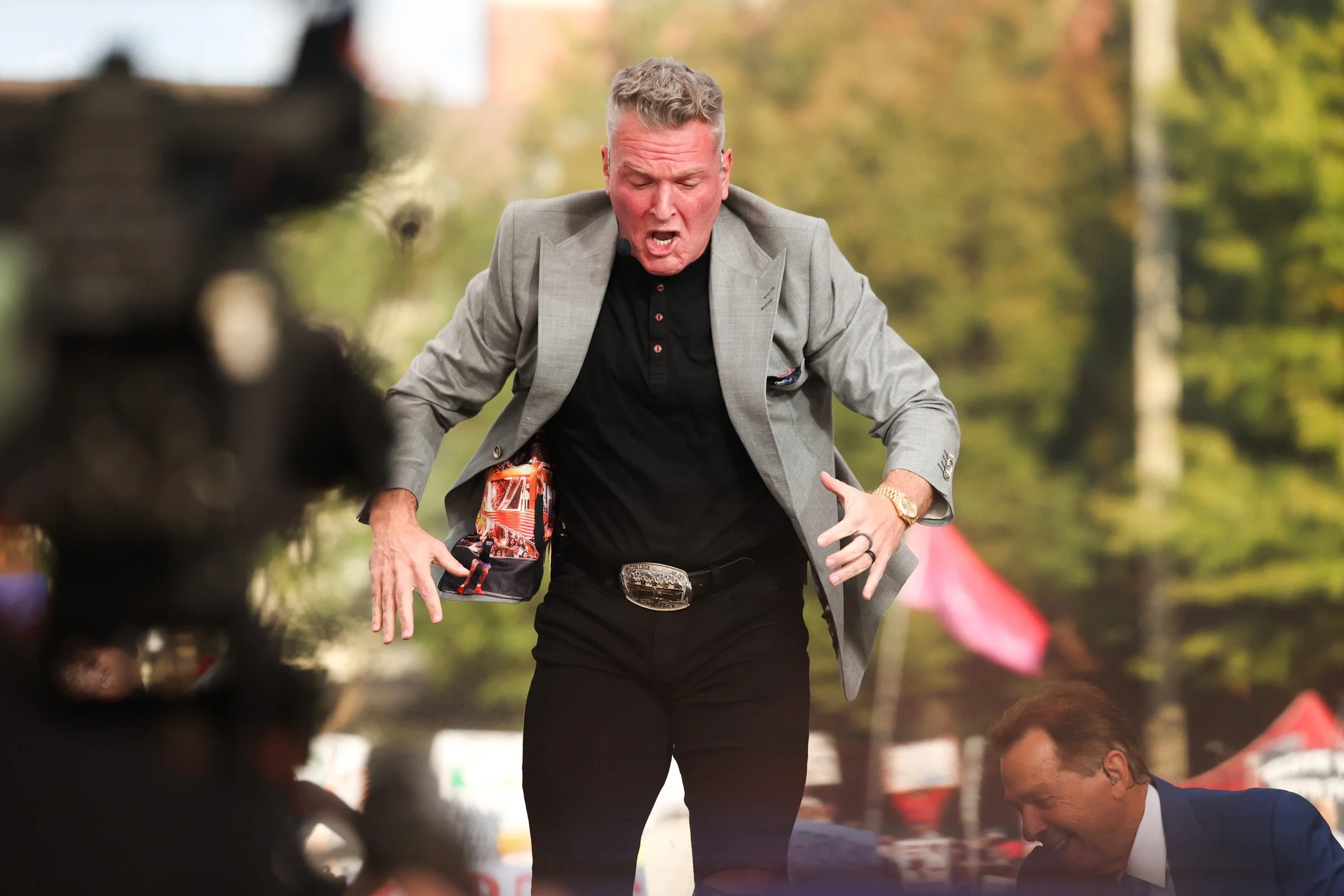 Pat McAfee stands on a chair while doing the Calling the Dawgs chant during College GameDay at Myers Quad in Athens, Georgia, on Saturday, Oct. 18, 2025. College GameDay visited Athens before the Georgia vs. Ole Miss football game. (Photo/Kaleb Tatum