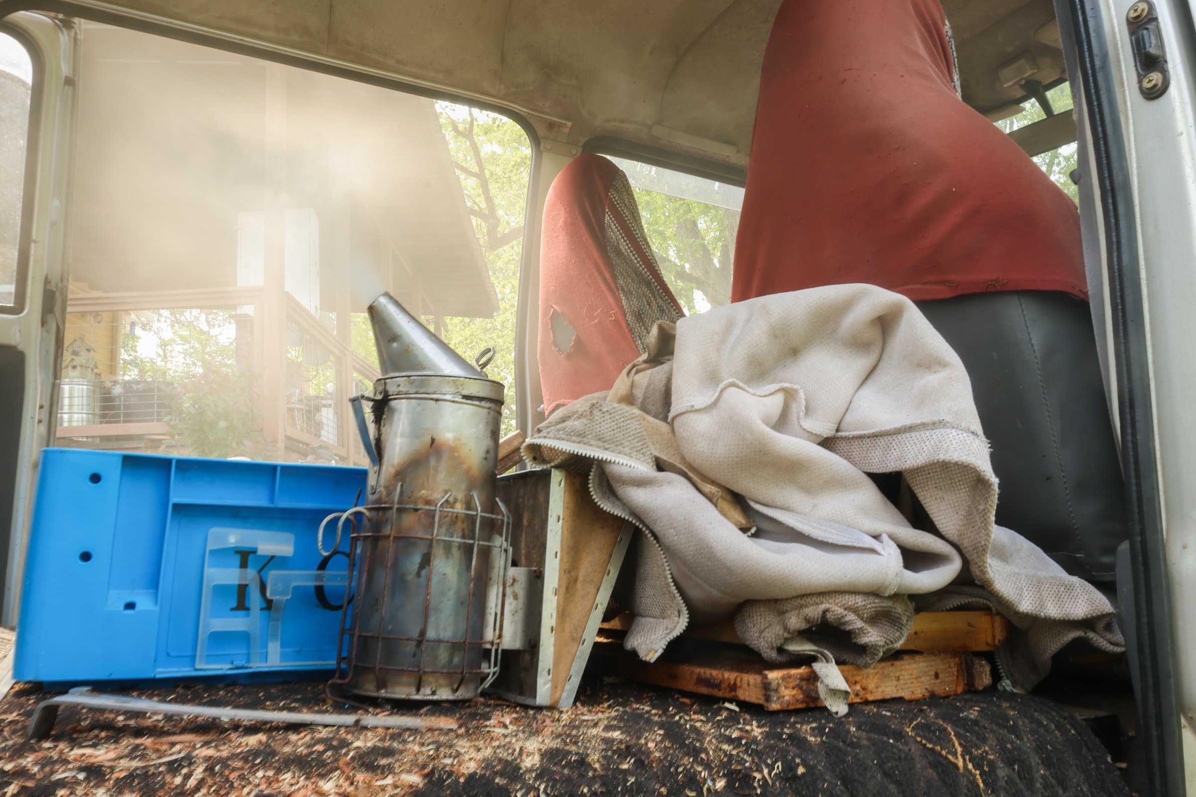 A smoker sits inside Tom Hankins's bee van in Danielsville, Georgia, on April 14, 2025. Hankins uses the smoke before opening the beehives to prevent himself from being stung.