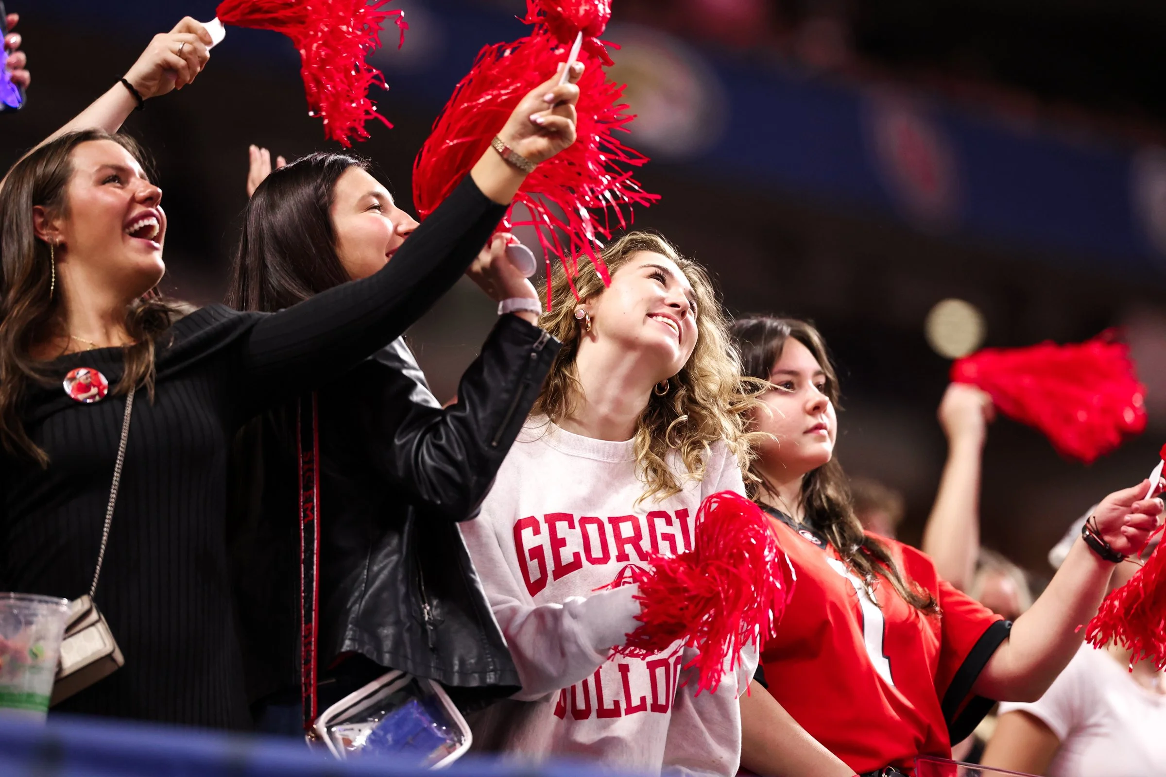 Georgia fans sing and dance during the first half of the SEC Championship game between Georgia and Alabama at Mercedes-Benz Stadium in Atlanta, Georgia, on Saturday, Dec. 6, 2025. Georgia leads 14-0. (Photo/Kaleb Tatum)