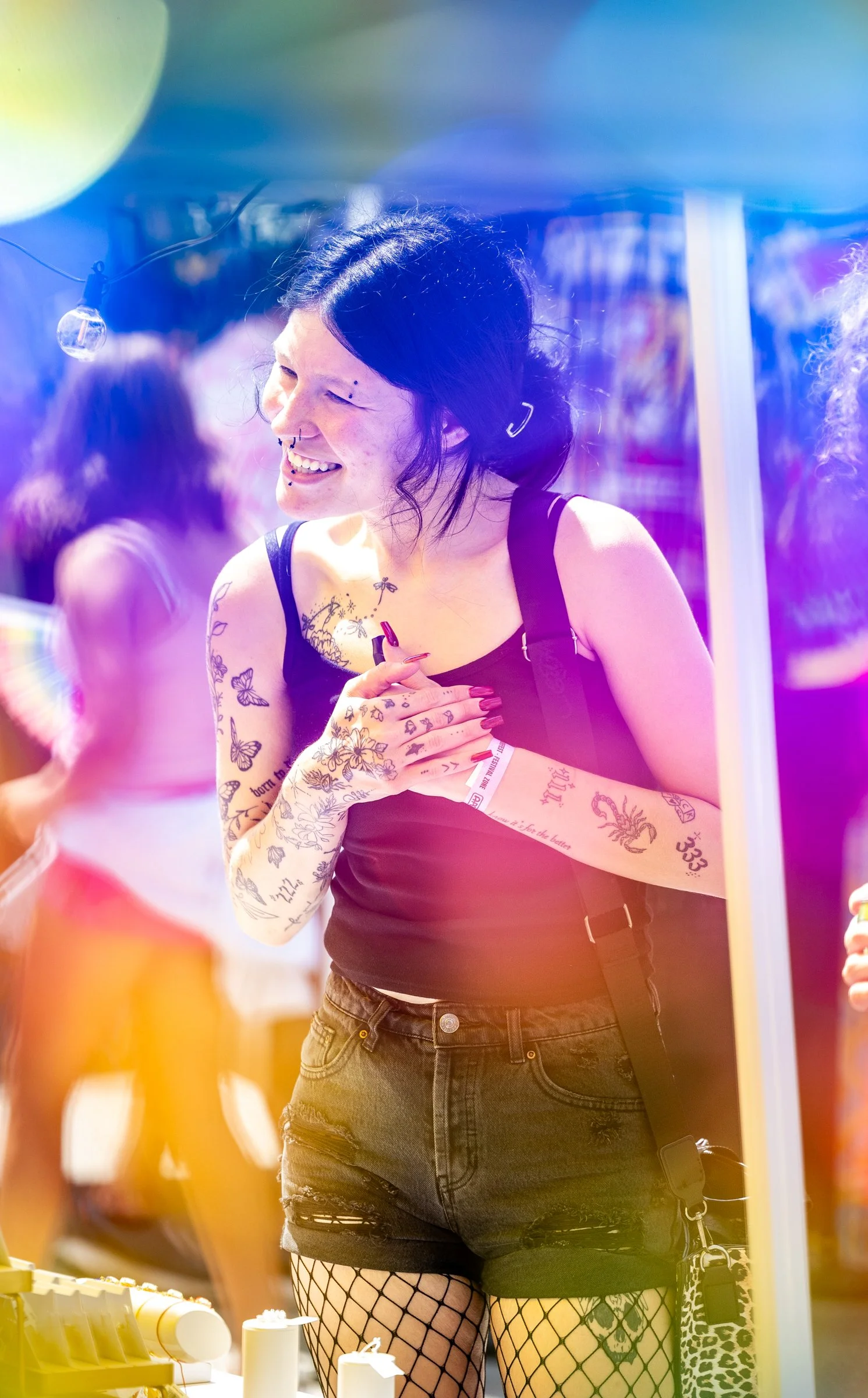 Jaden Gawenda speaks with a vendor during Pridefest, hosted by Athens Pride & Queer Collective, in downtown Athens, Georgia, on Saturday, June 6, 2026. In addition to the parade, Pridefest features live music and performances, vendors and a kid zone.