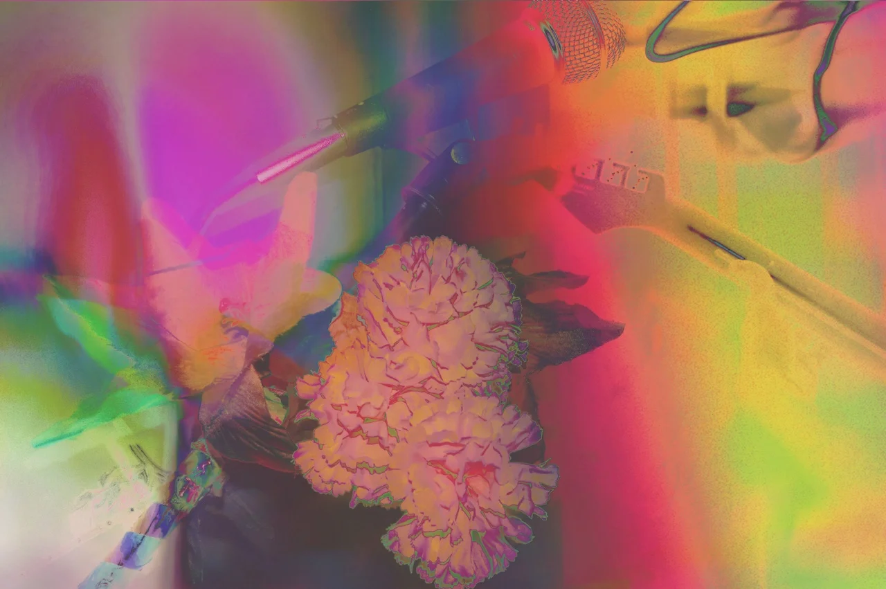 A colorful, distorted image of a microphone, a person's hand holding a paintbrush, and a pink flower on a yellow surface.