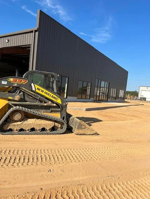 Skid steer grading land in Bartlett TN