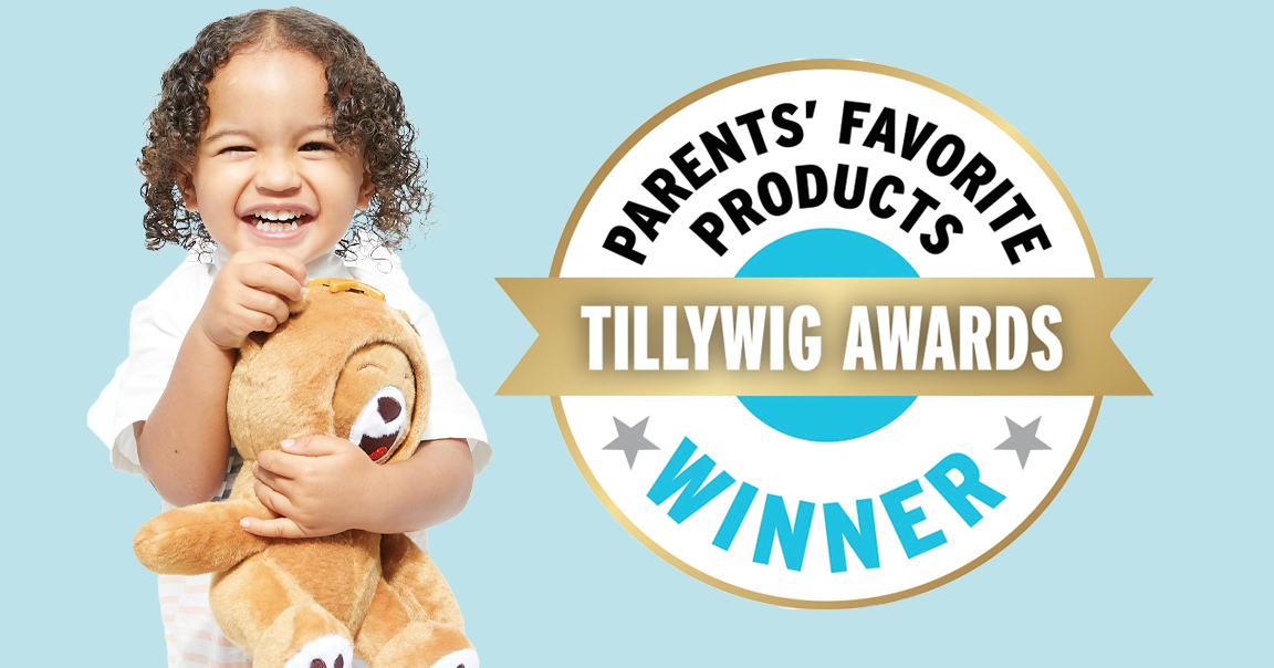 A young girl with curly hair smiles while holding a teddy bear, standing beside a circular badge that reads "Parents' Favorite Products Tillywig Awards Winner".