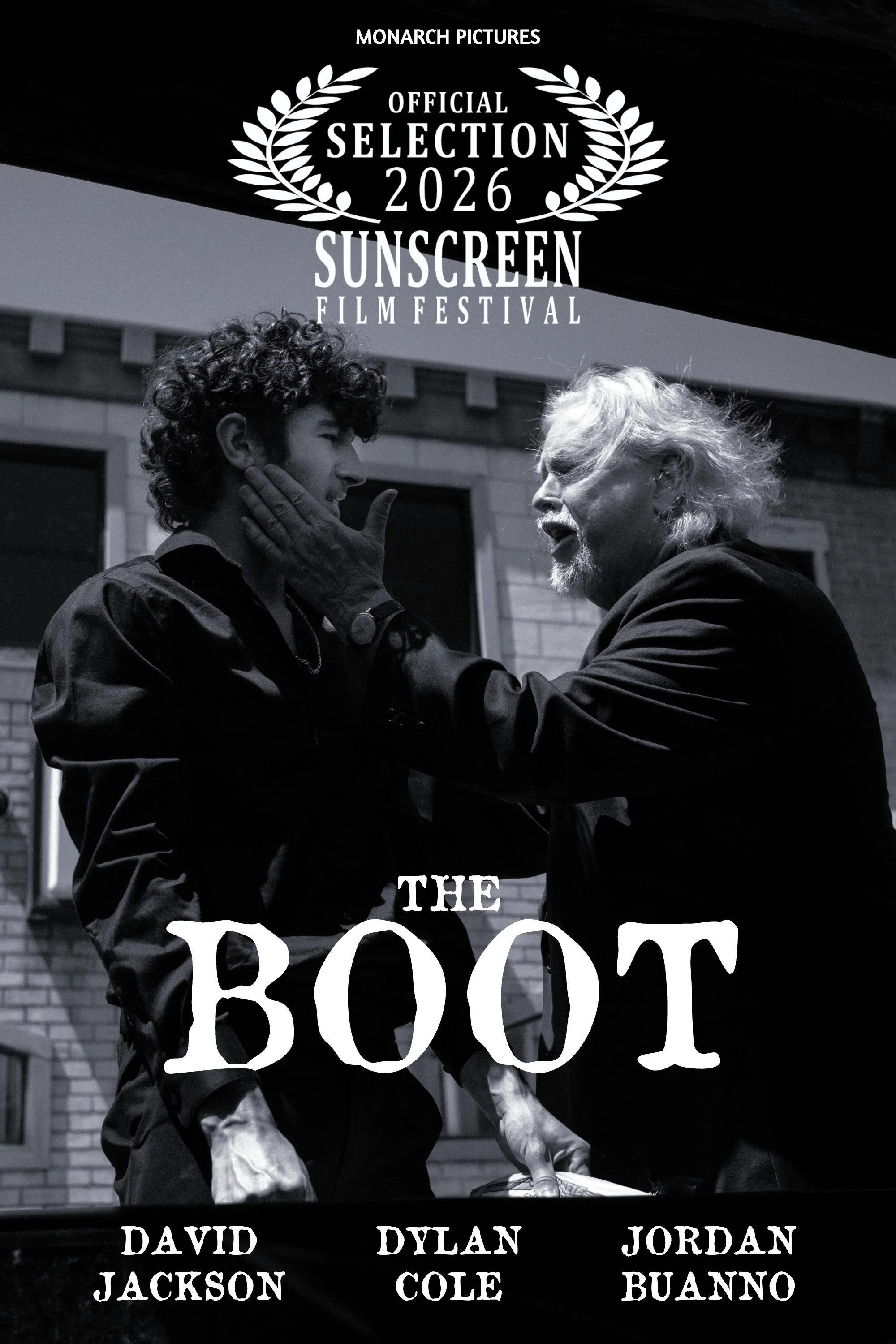 Black and white poster for the 2026 Sunscreen Film Festival, featuring two men facing each other, one older and one younger, engaging in a dramatic moment. The poster includes the festival's logo at the top and the word 'BOOM' in large letters in the
