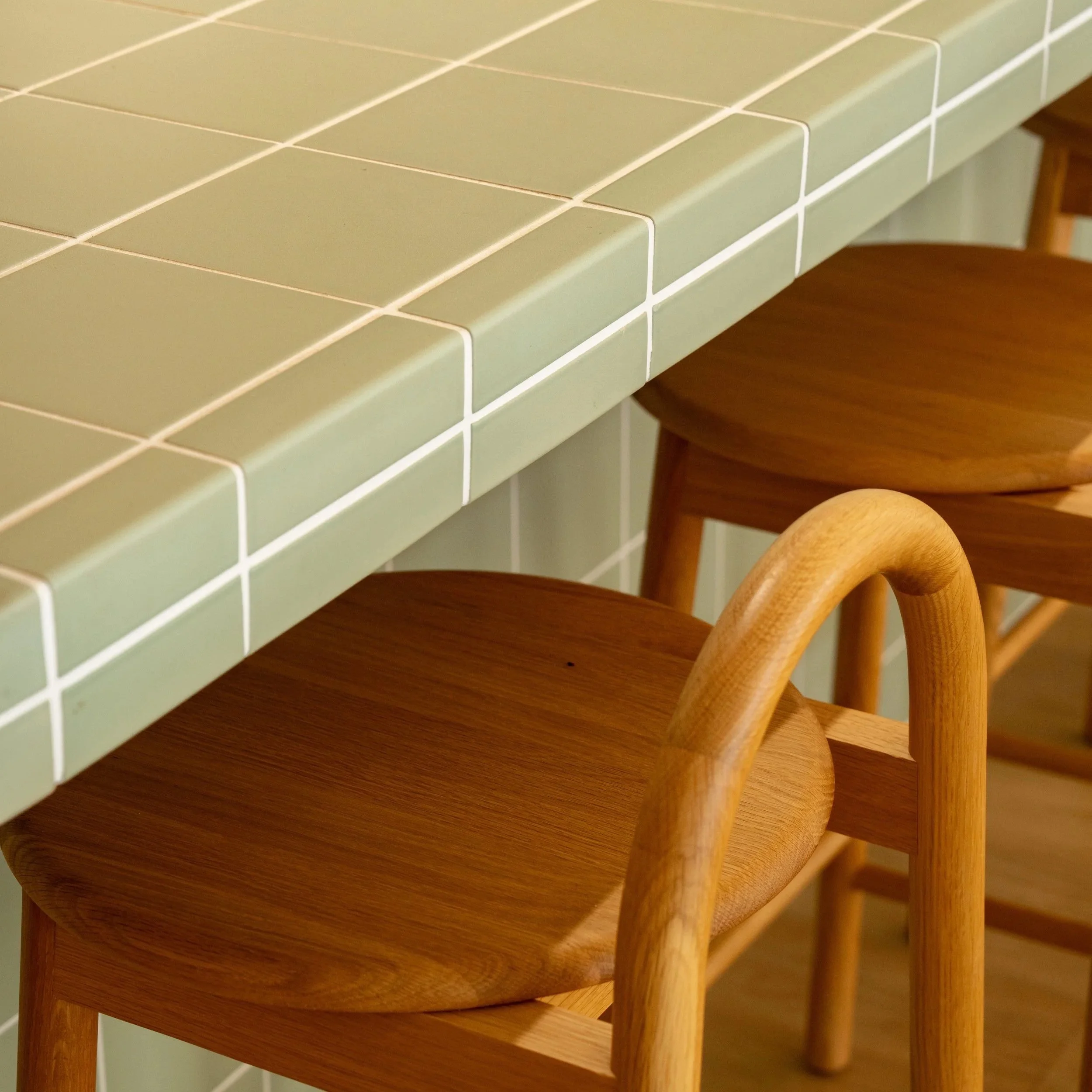Stone kitchen island benchtop and timber cabinetry detail