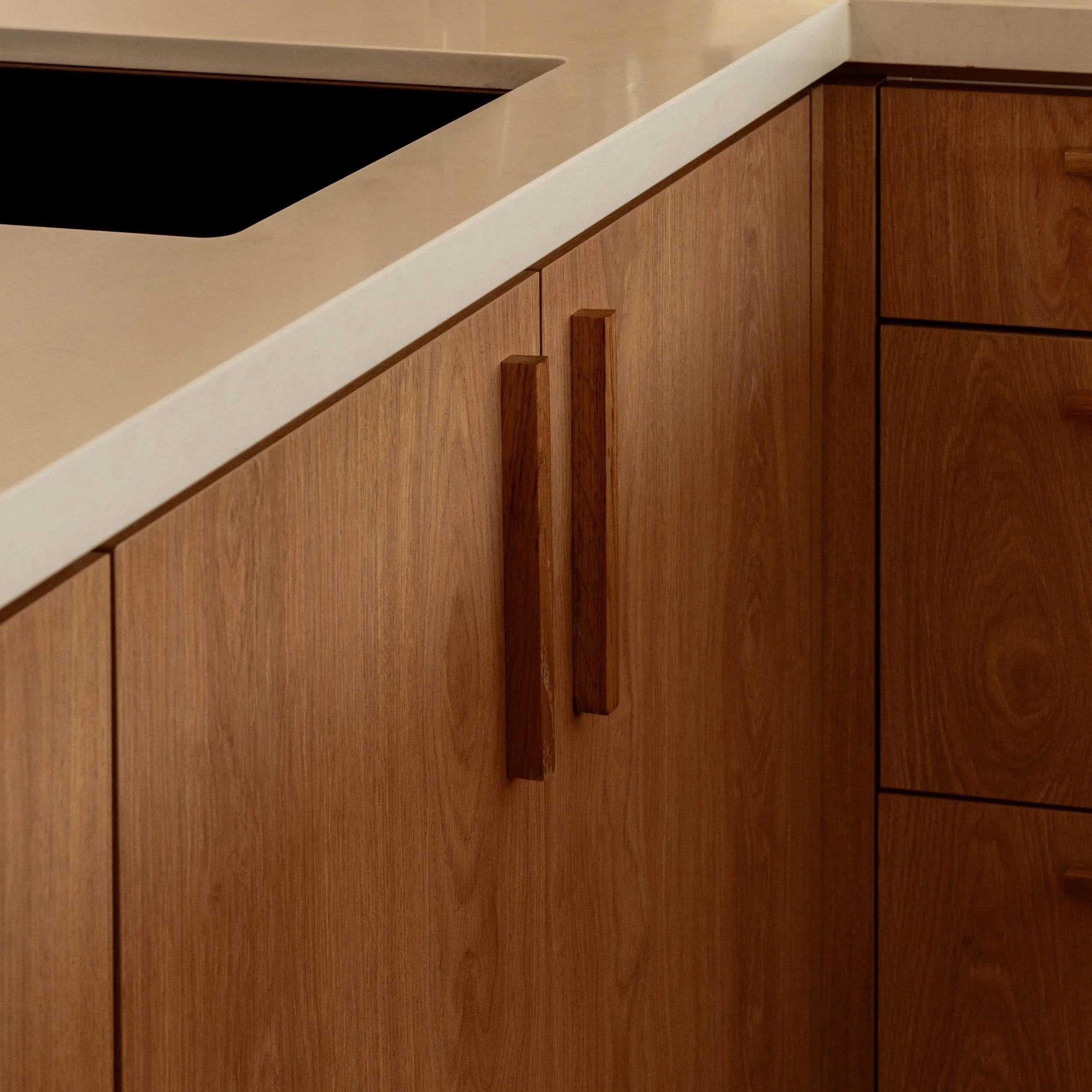 Custom kitchen cabinetry and stone benchtop detail