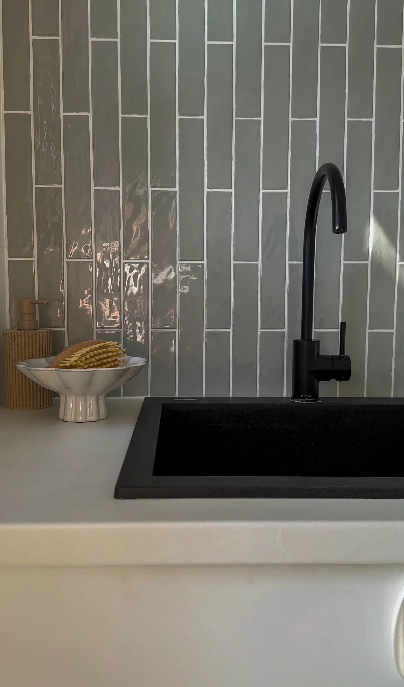 Modern laundry sink and custom cabinetry in Glenelg South