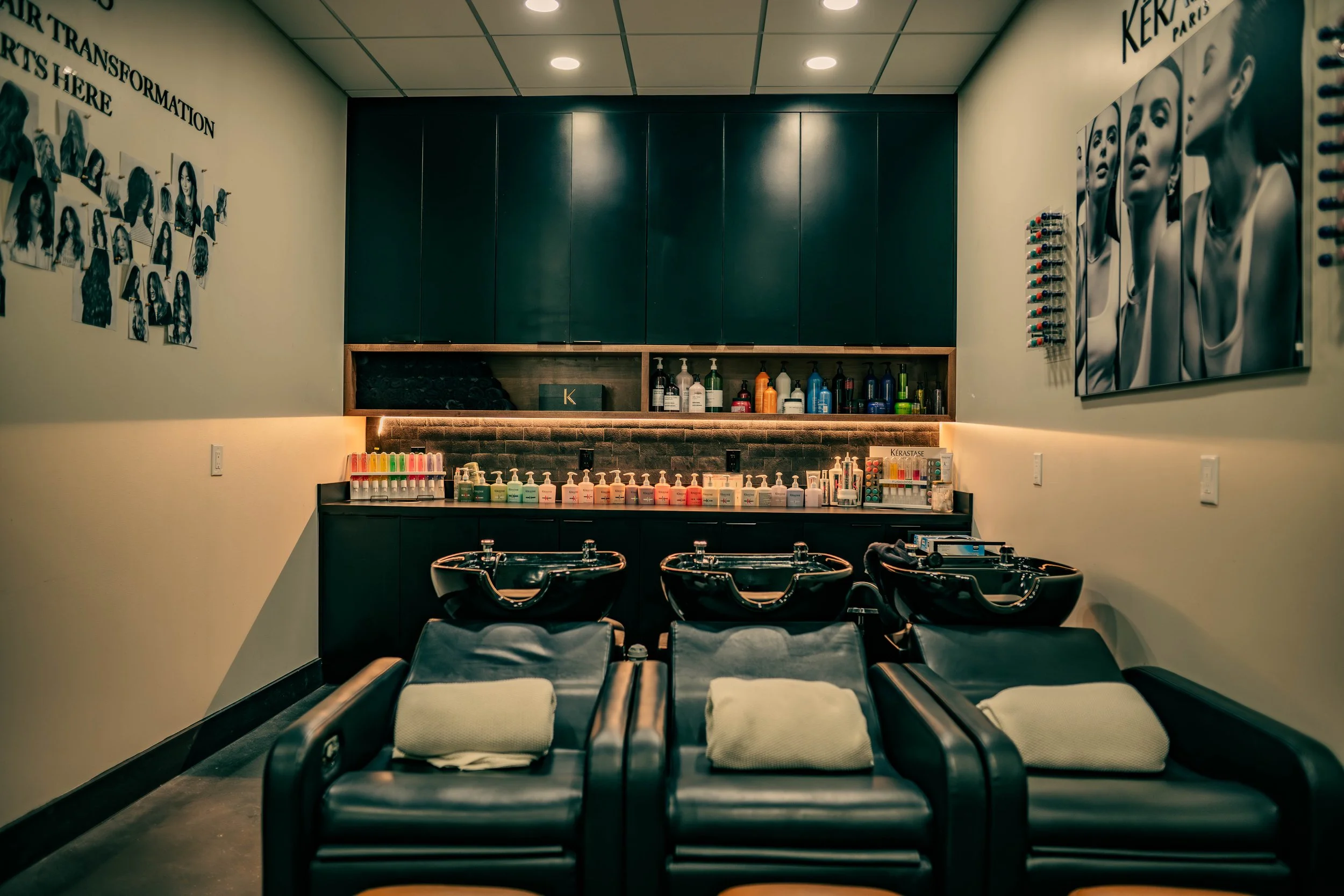 The premium shampoo lounge at Très Ivanhoe Salon in Orlando, featuring comfortable leather seating and exclusive Kérastase Paris hair treatments.