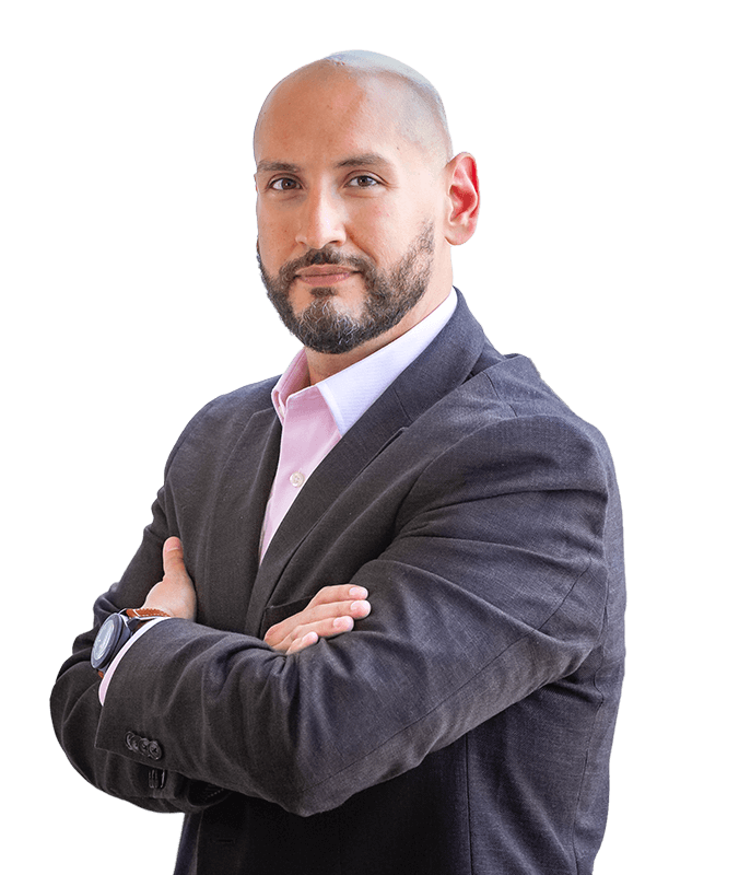 Marcos Torres, leadership advisor and keynote speaker, standing with arms crossed against a transparent background.