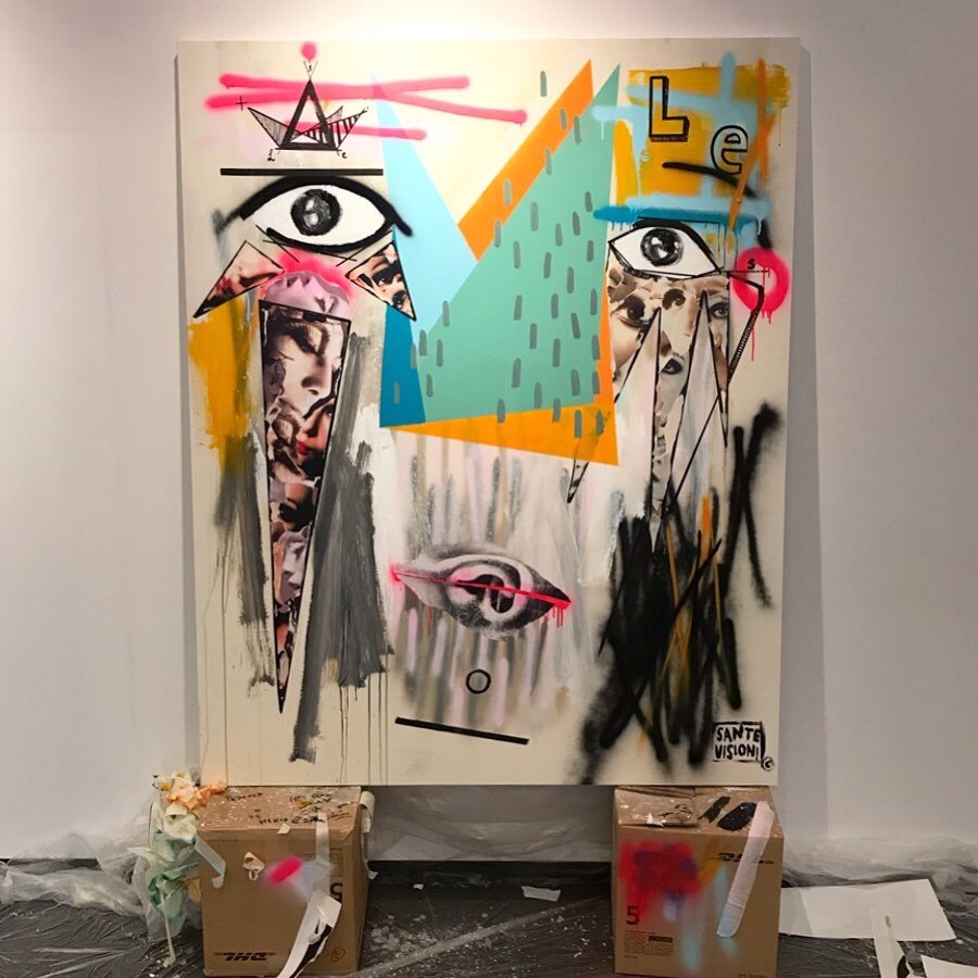 MODE II, 2019, mixed media on canvas, abstract graffiti-style artwork featuring geometric shapes, spray paint splatters, and various markings in black, pink, blue, yellow, and orange. The piece includes collage elements and layered textures.