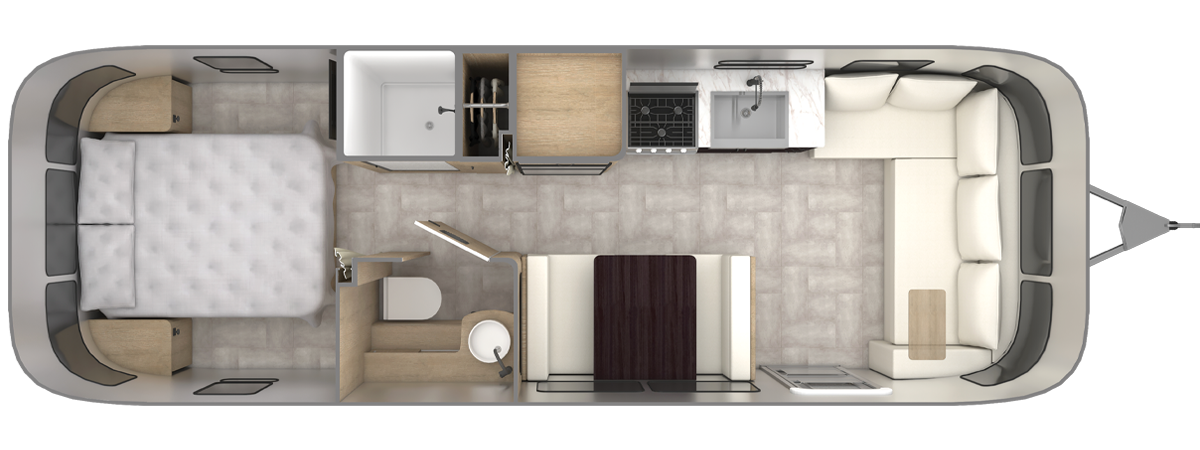 A top-down view of a compact RV interior with a bedroom, bathroom, kitchen, and living area featuring a sofa and small dining table.