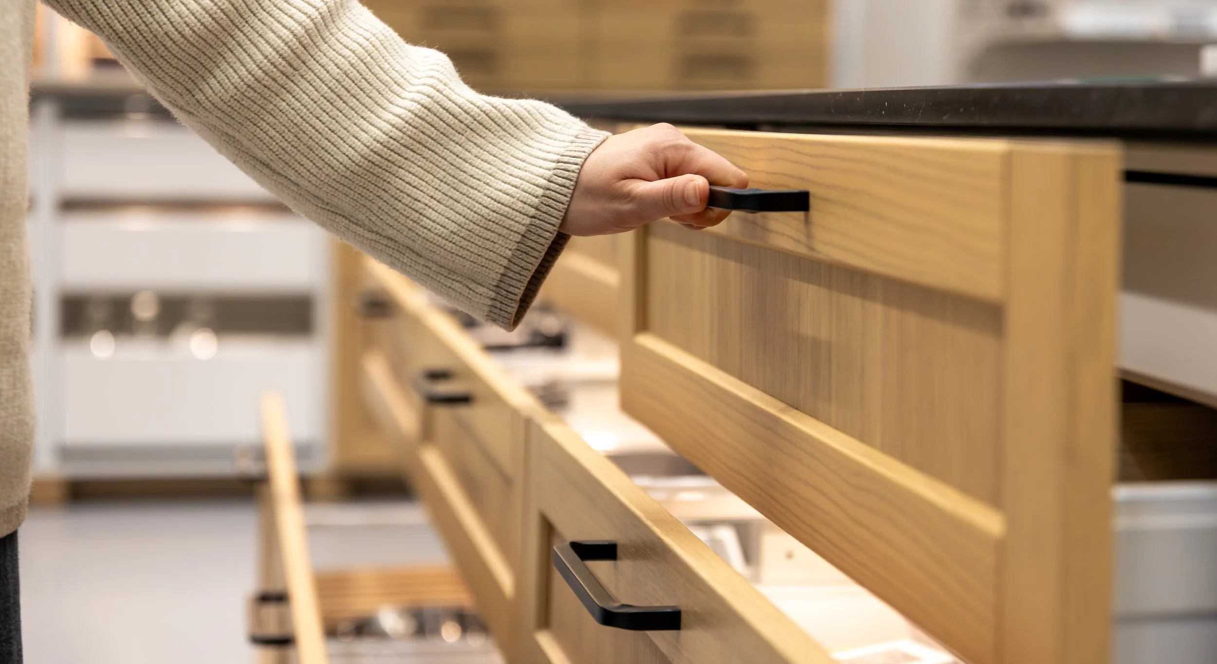 hand-opens-two-kitchen-drawers-space-organization.jpg