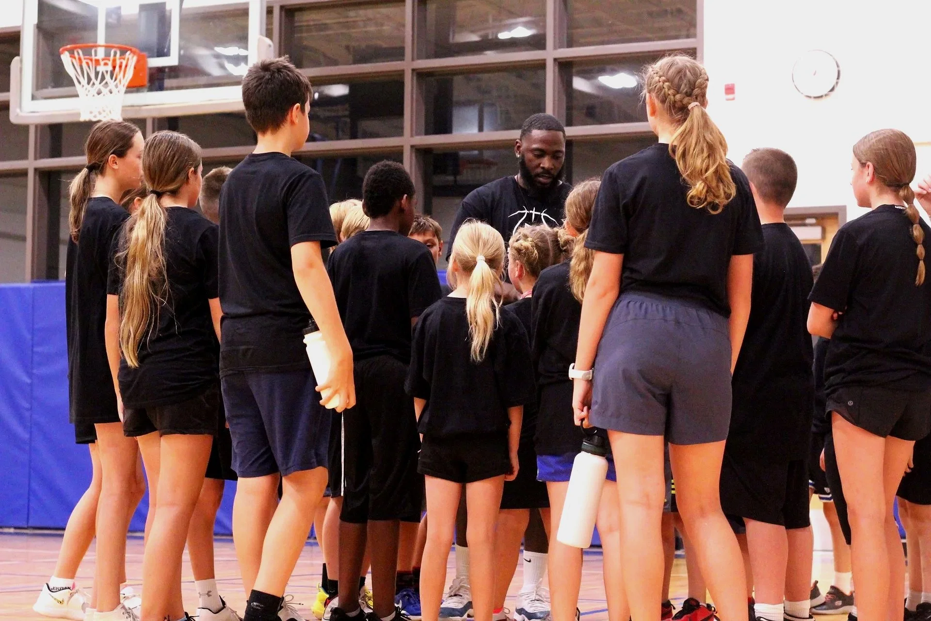 Group of athletes with coach