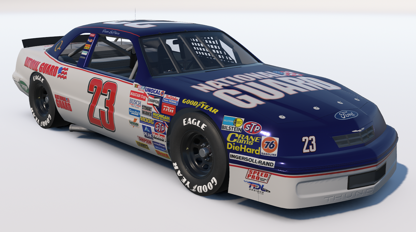 A NASCAR race car numbered 23 with a blue and white paint scheme, featuring various sponsor logos including National Guard, Ford, Goodyear, and others, on a plain white background.