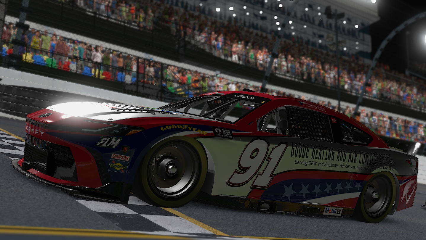 A race car in red, white, and blue livery with the number 91 and 'Goode Heating and Air Conditioning' branding, on a racetrack with a grandstand full of spectators in the background.