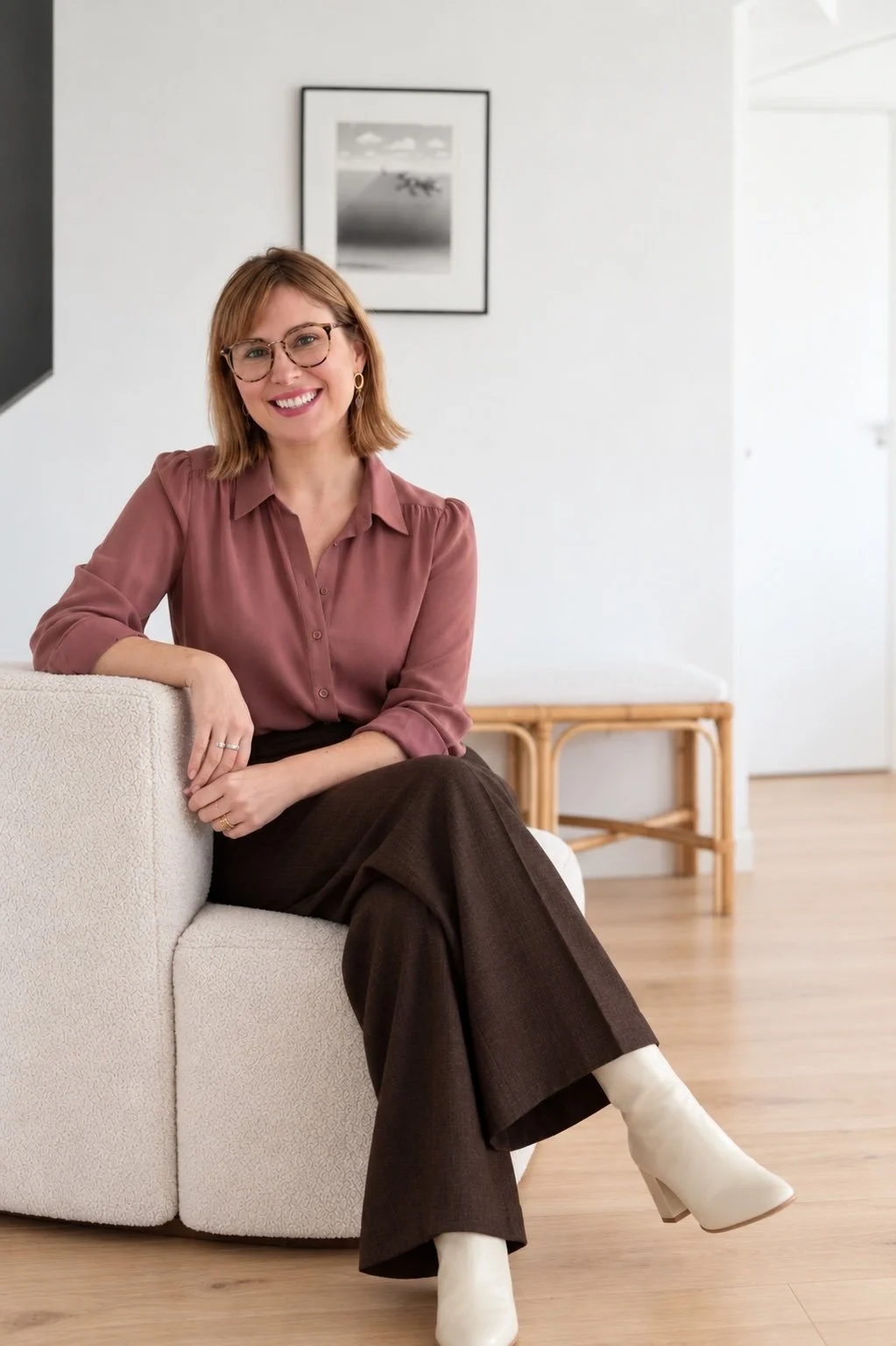 Carly Morris, founder of Arc Narratives, smiling and seated in a light room