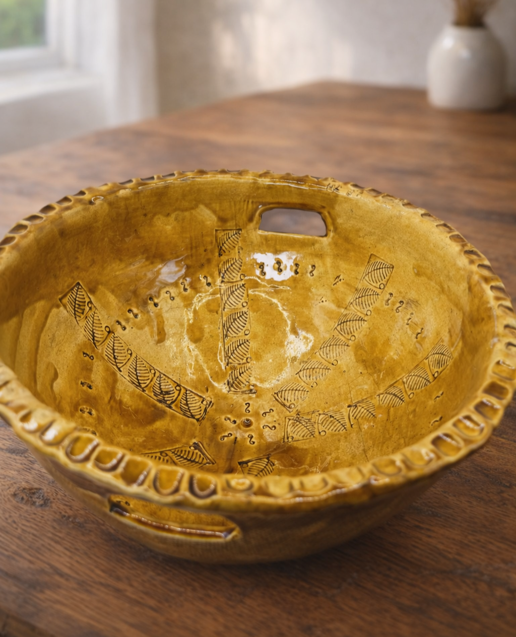 The-Unbound-Canvas-Blue-big-yellow-Ceramic-bowl-on-rustic-wood-table-2.png