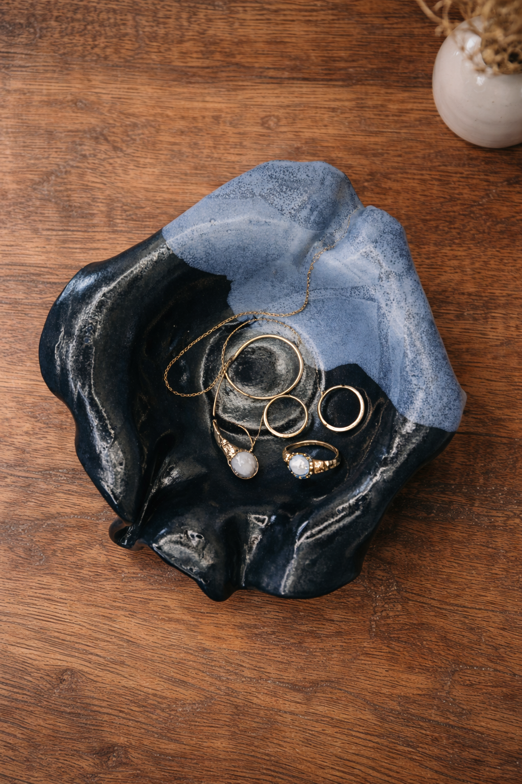 The-Unbound-Canvas-Blue- Floral-Ceramic-bowl-on-rustic-wood-table-with-jewelry.png