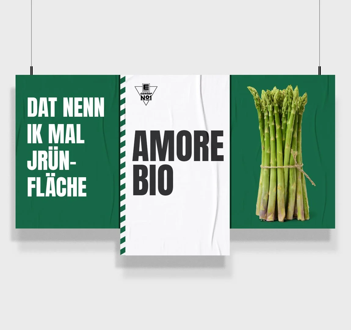 EDEKA No1 - Storytelling Bündel frischer grüner Spargel auf einer Werbetafel mit grünem und weißem Hintergrund, mit Text in deutscher Sprache.