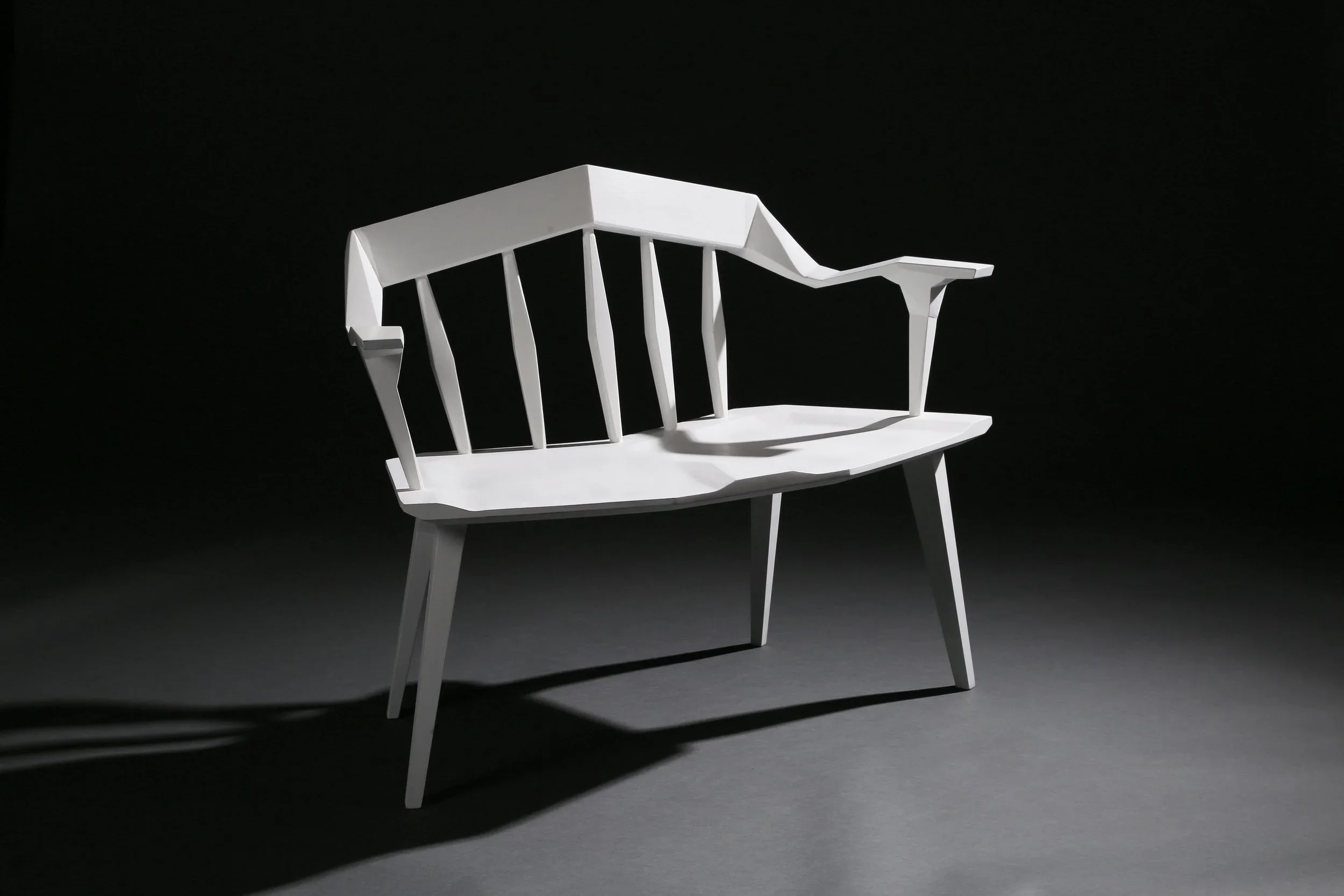 One of a pair of white angular custom furniture benches