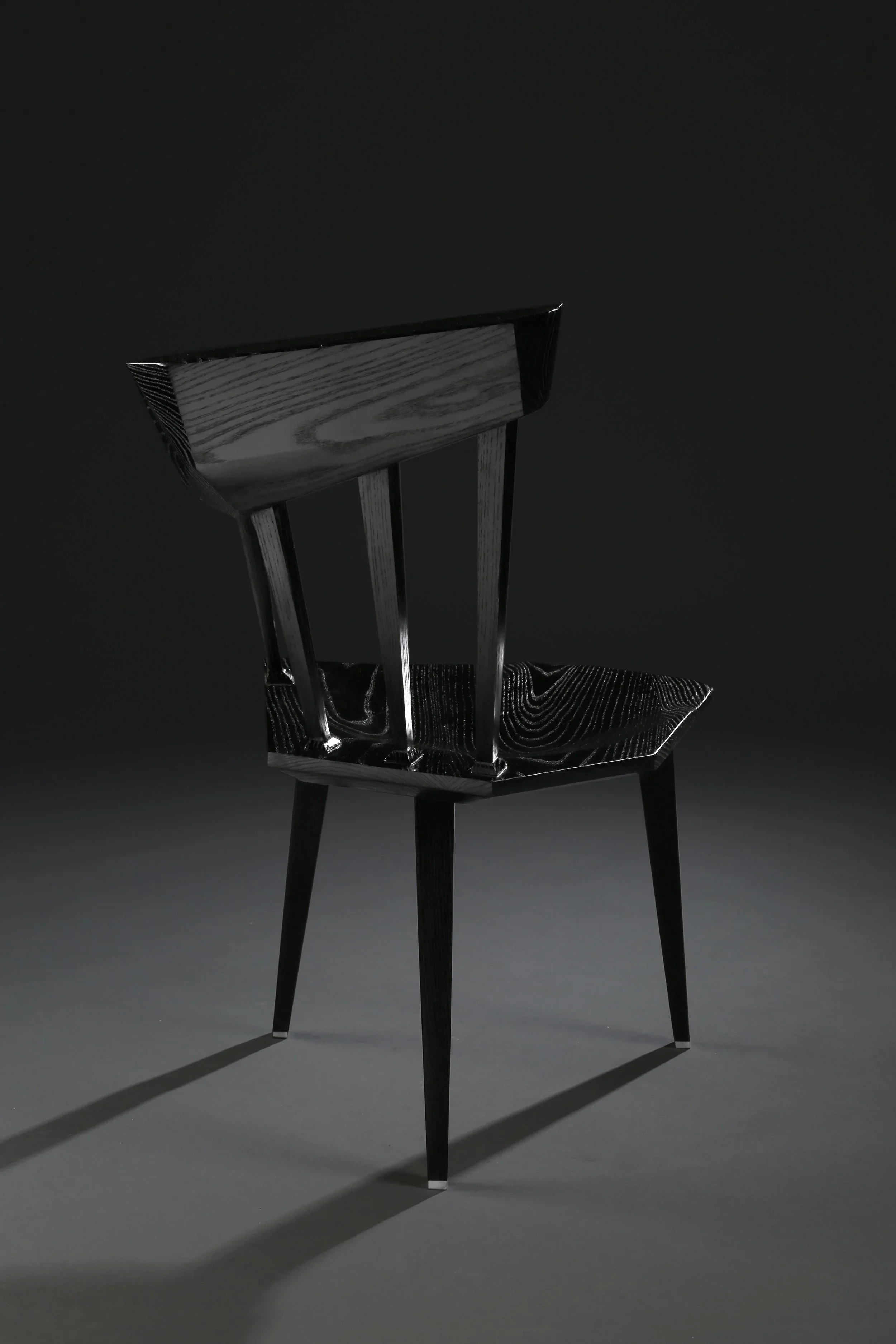 An angular black custom chair