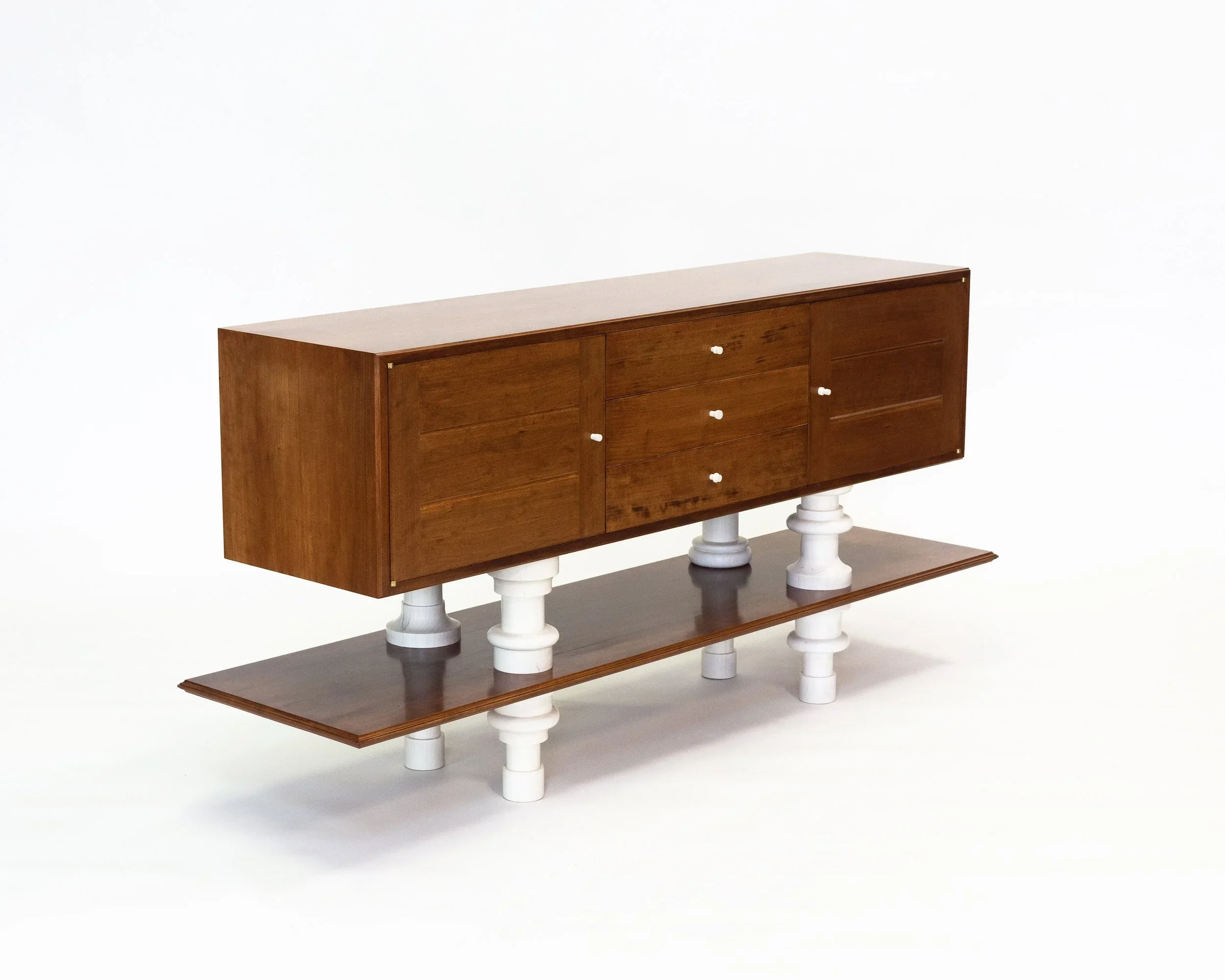 A custom furniture cabinet with turned legs