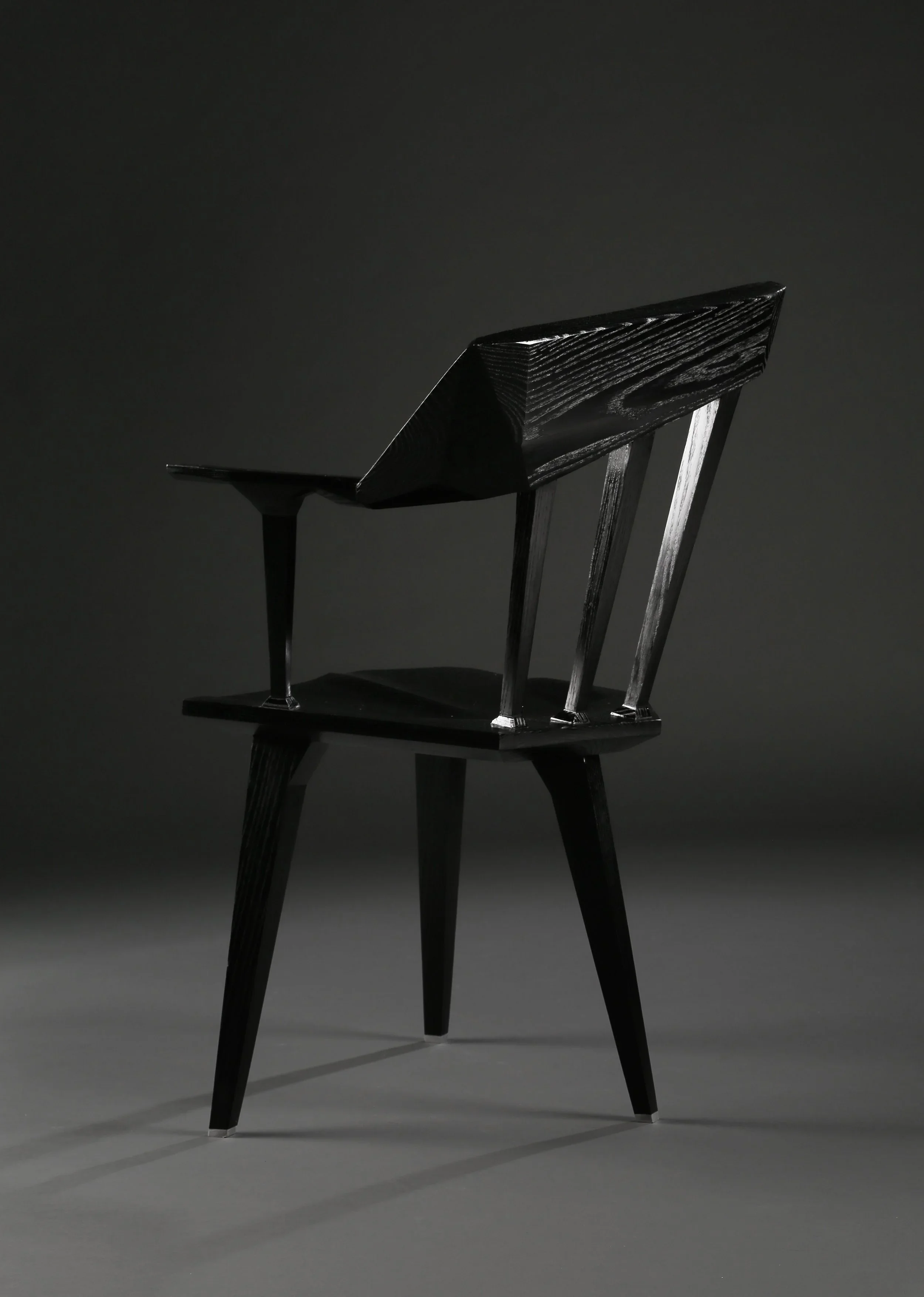 An angular black custom chair