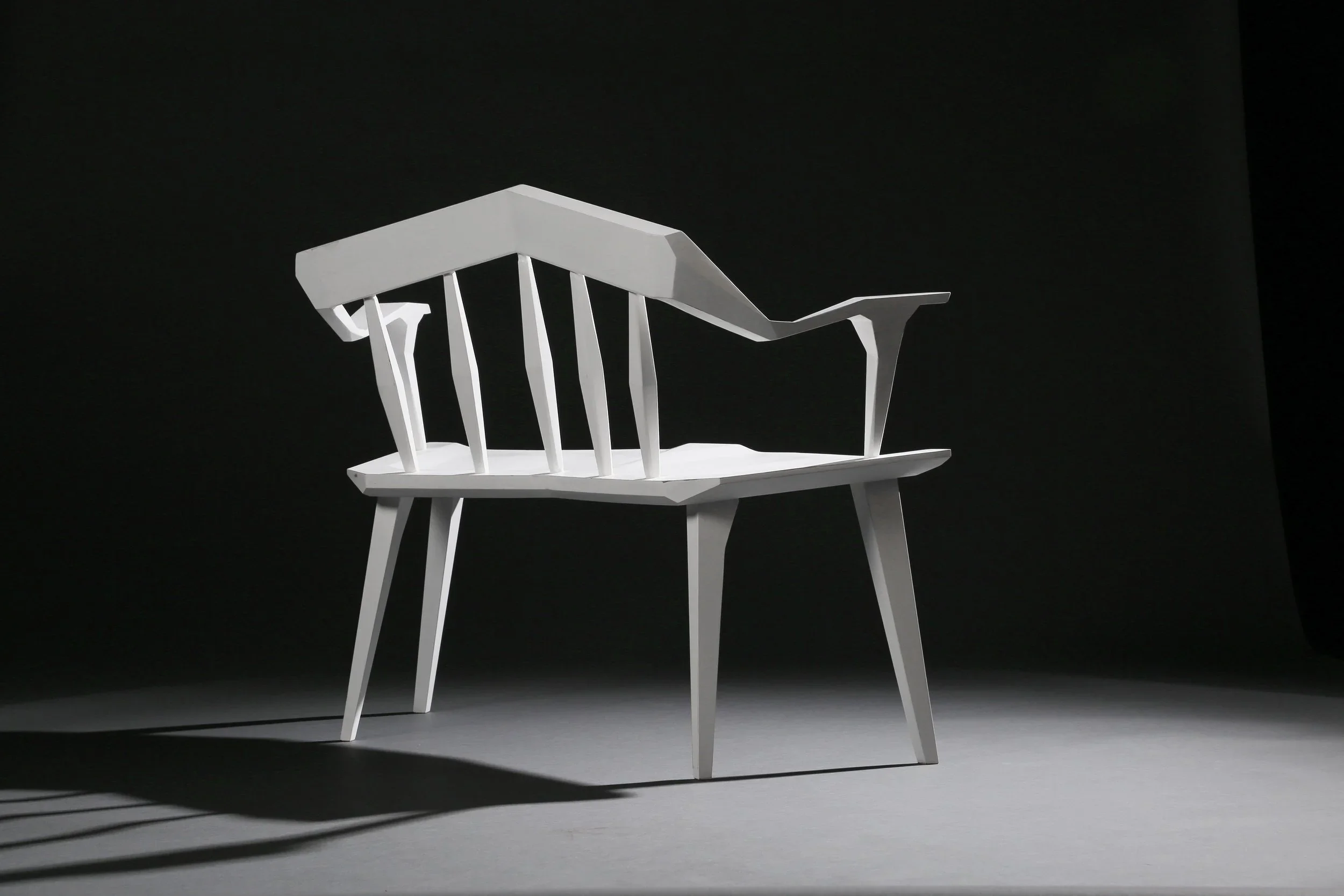 One of a pair of white angular custom furniture benches