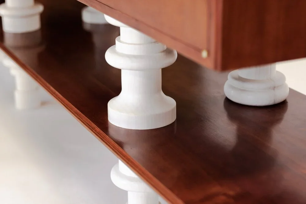 A custom furniture cabinet with turned legs